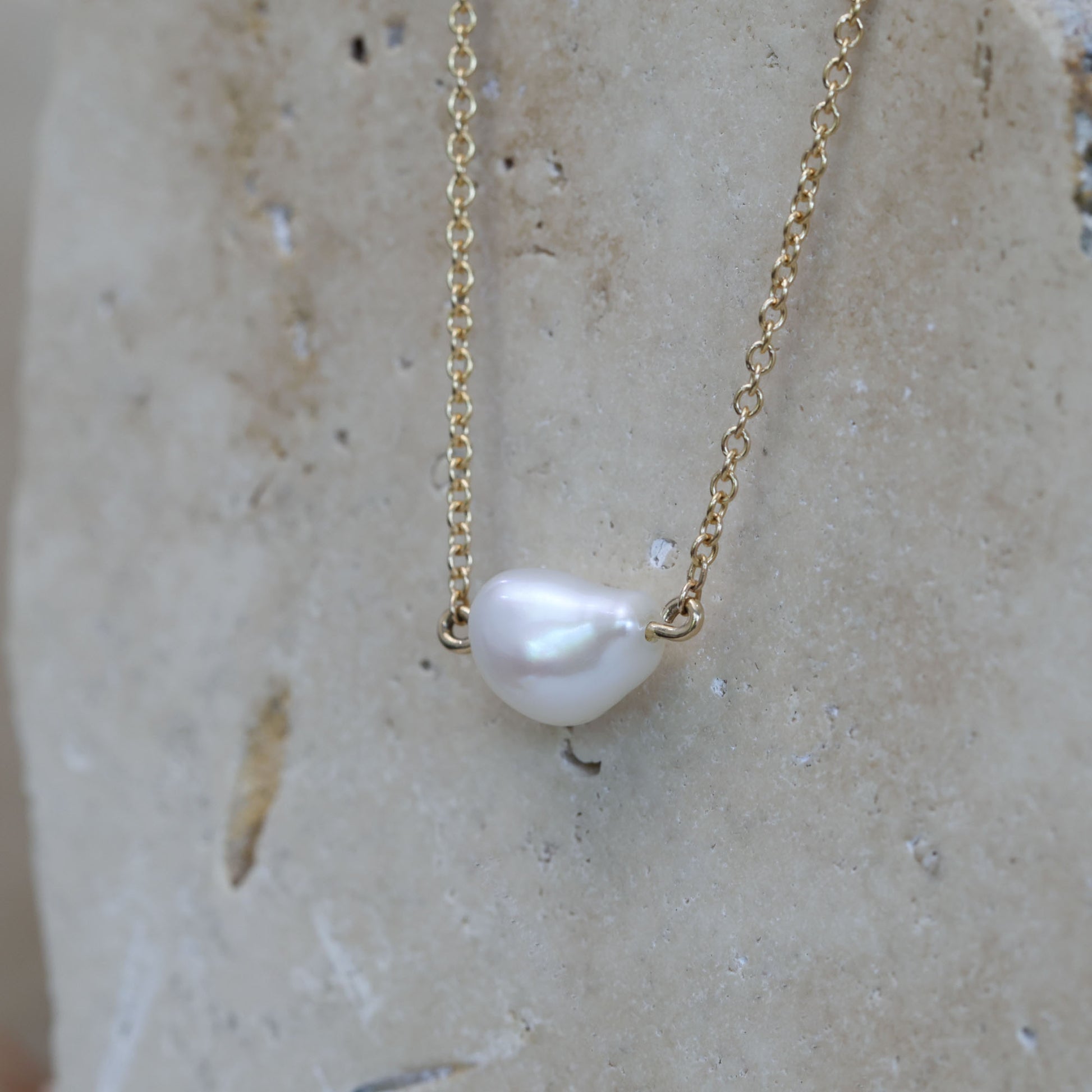 East west natural pearl necklace side
