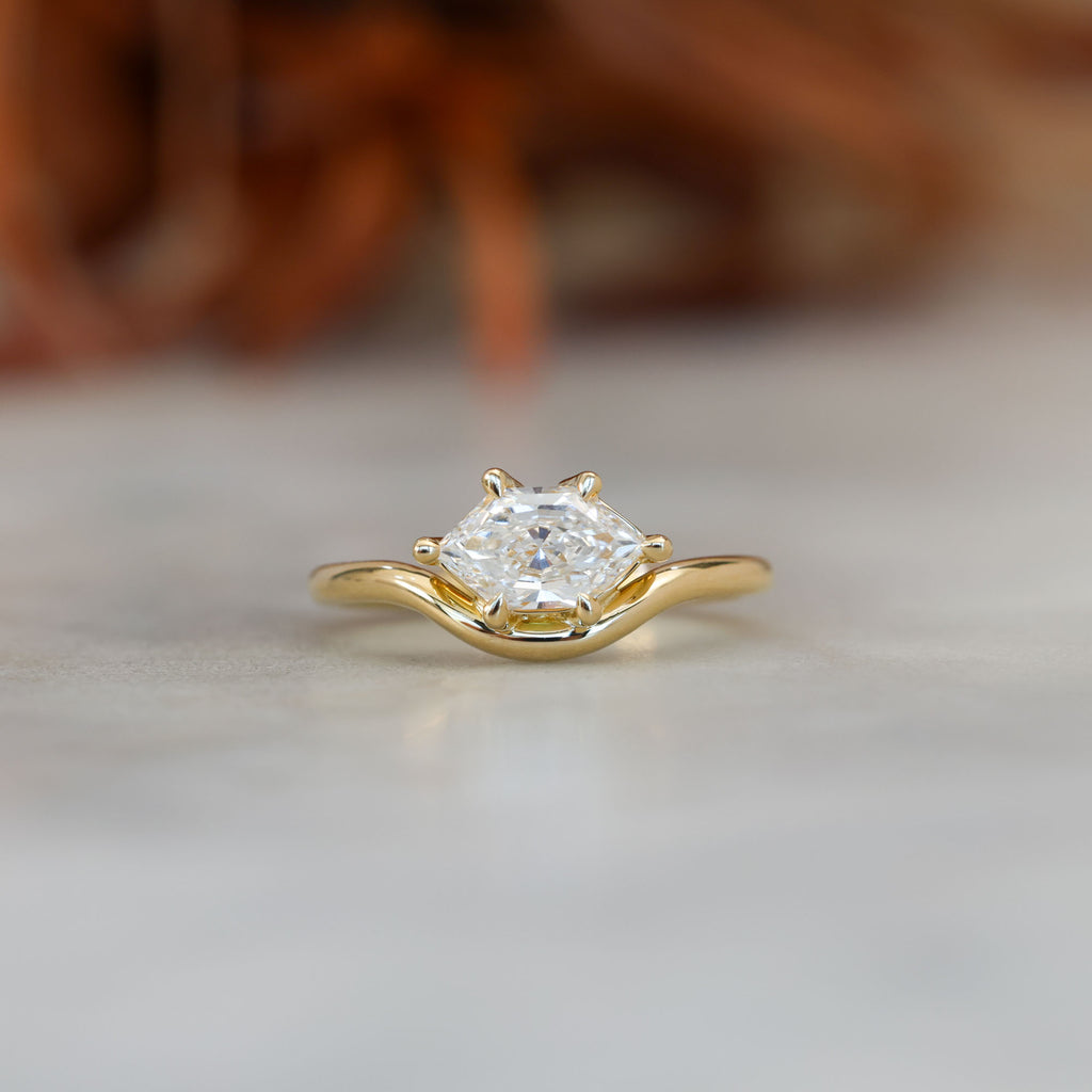 eden 1.00ct elongated hexagon diamond on curved yellow gold band