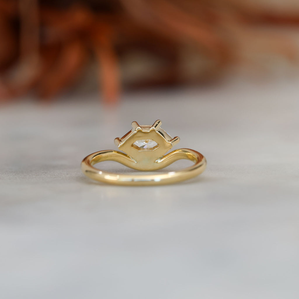 eden 1.00ct elongated hexagon diamond on curved yellow gold band back