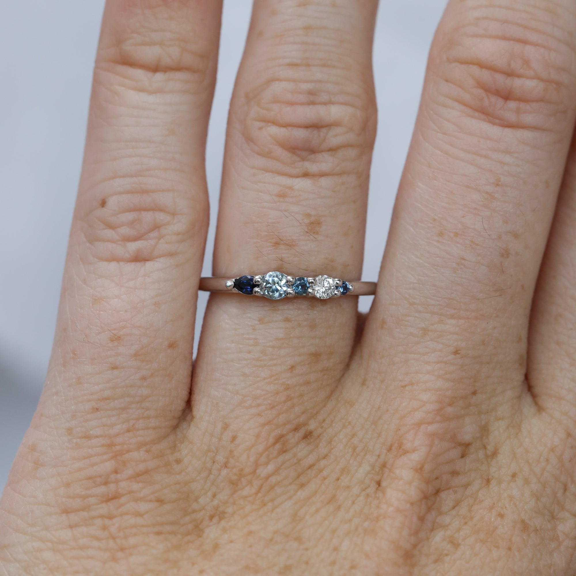 Eliza ring blue Ceylon sapphire and diamond fine jewellery ring on hand