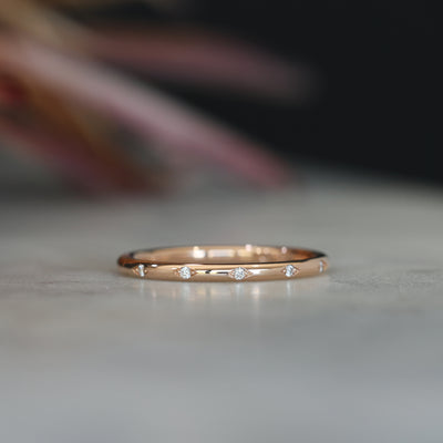 Flat diamond wedding band with star details