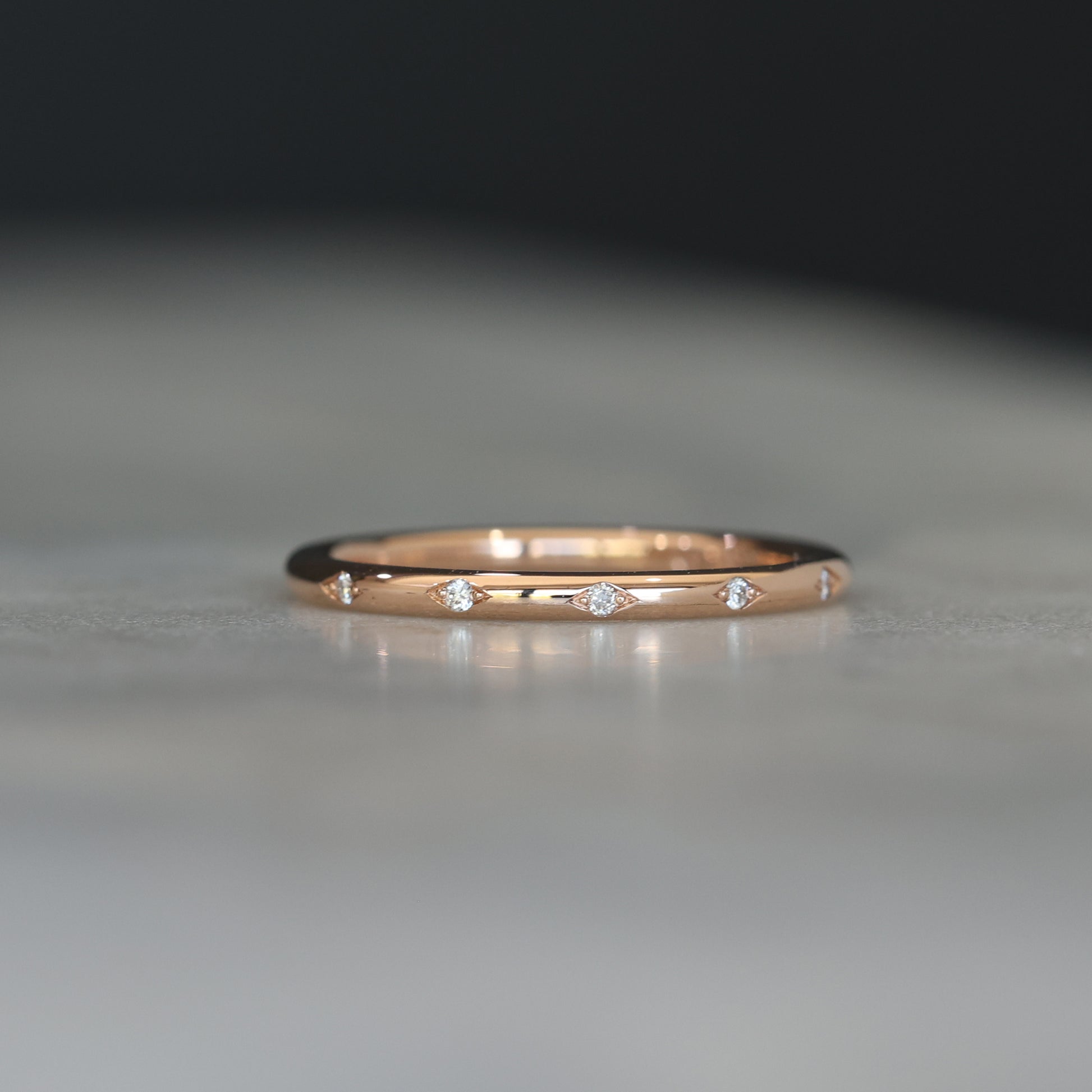 Flat diamond wedding band with star details front view