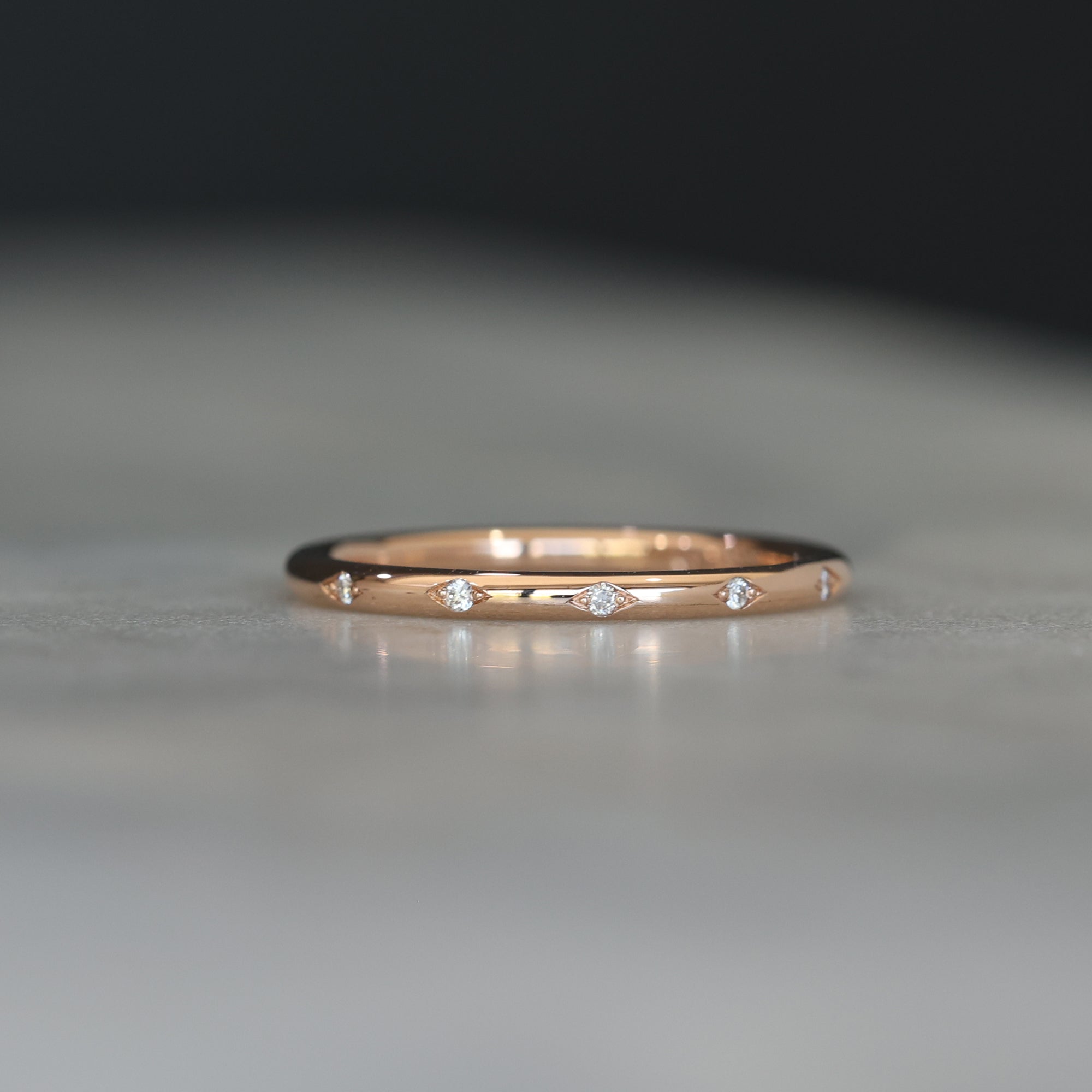 Flat diamond wedding band with star details front view