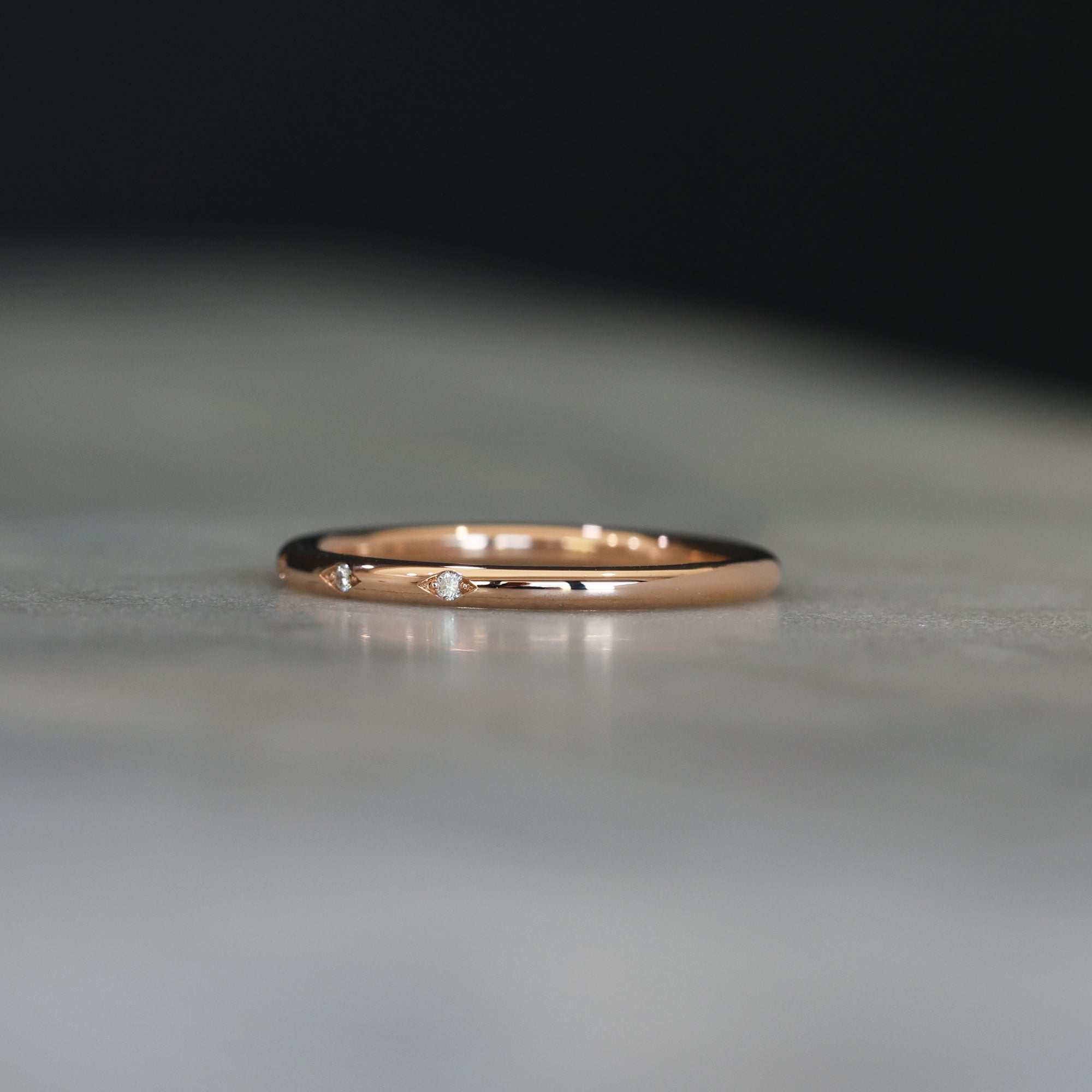 Flat diamond wedding band with diamond star details side view