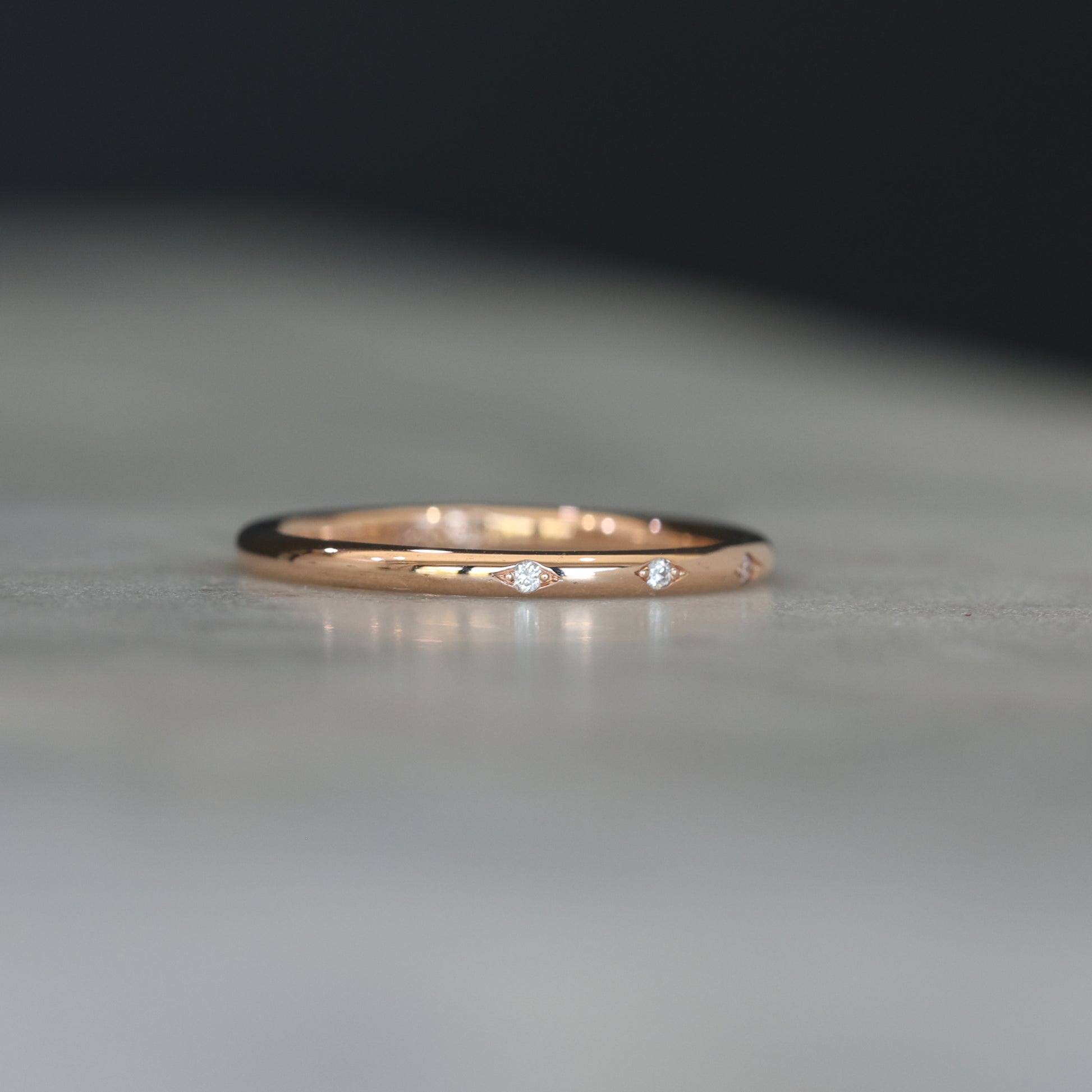 Flat diamond wedding band with star details side profile