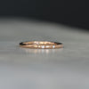 Flat diamond wedding band with star details side profile