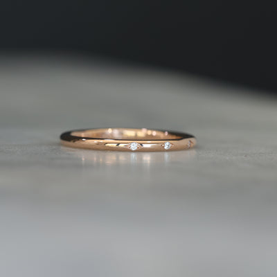 Flat diamond wedding band with star details side profile