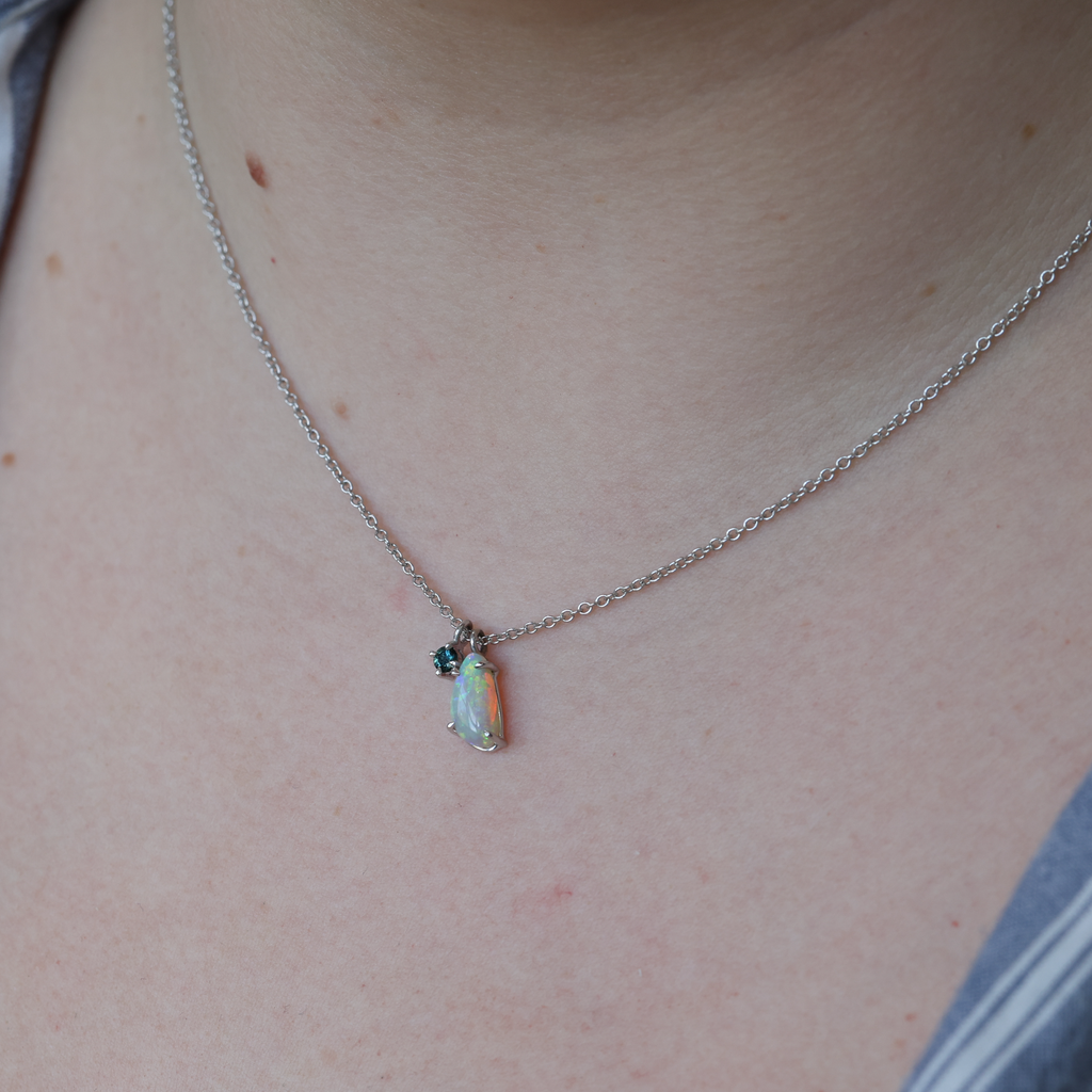 Freeform Opal & Teal Round Cut Sapphire necklace on neck