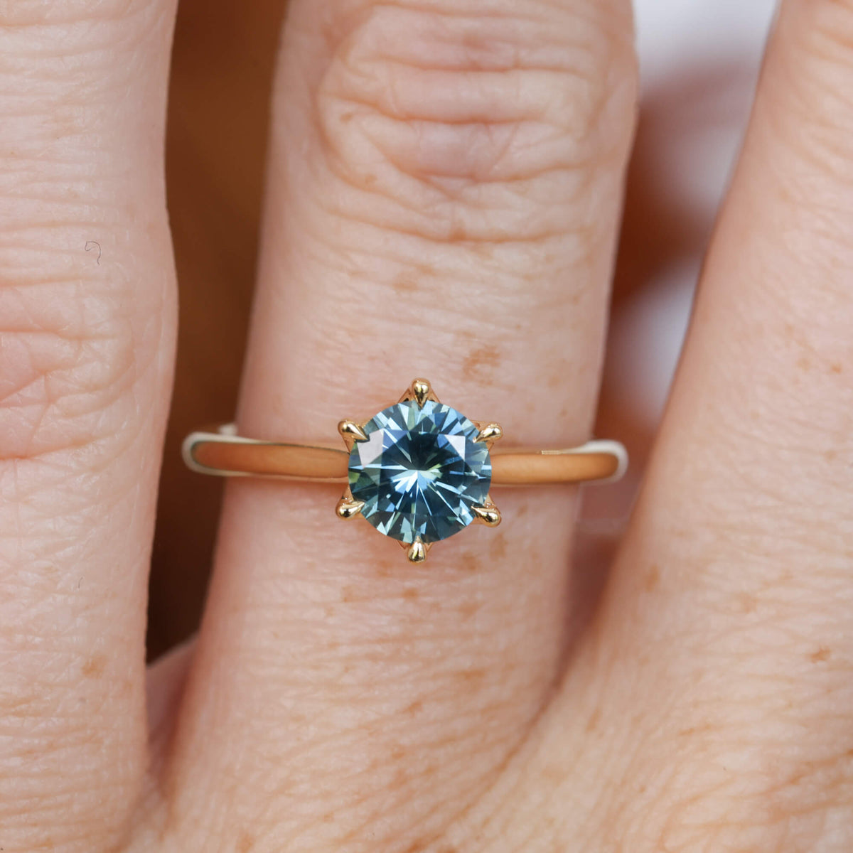Lotus 1.01ct round cut montana sapphire solitaire engagement ring with cathedral setting