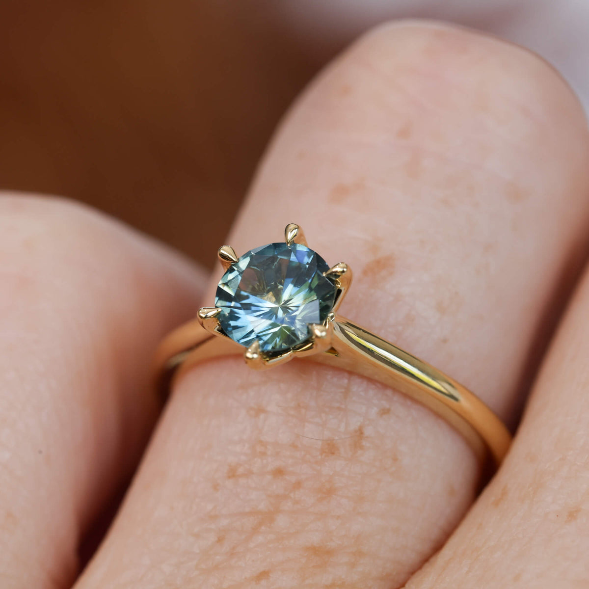 Lotus 1.01ct round cut montana sapphire solitaire engagement ring with cathedral setting