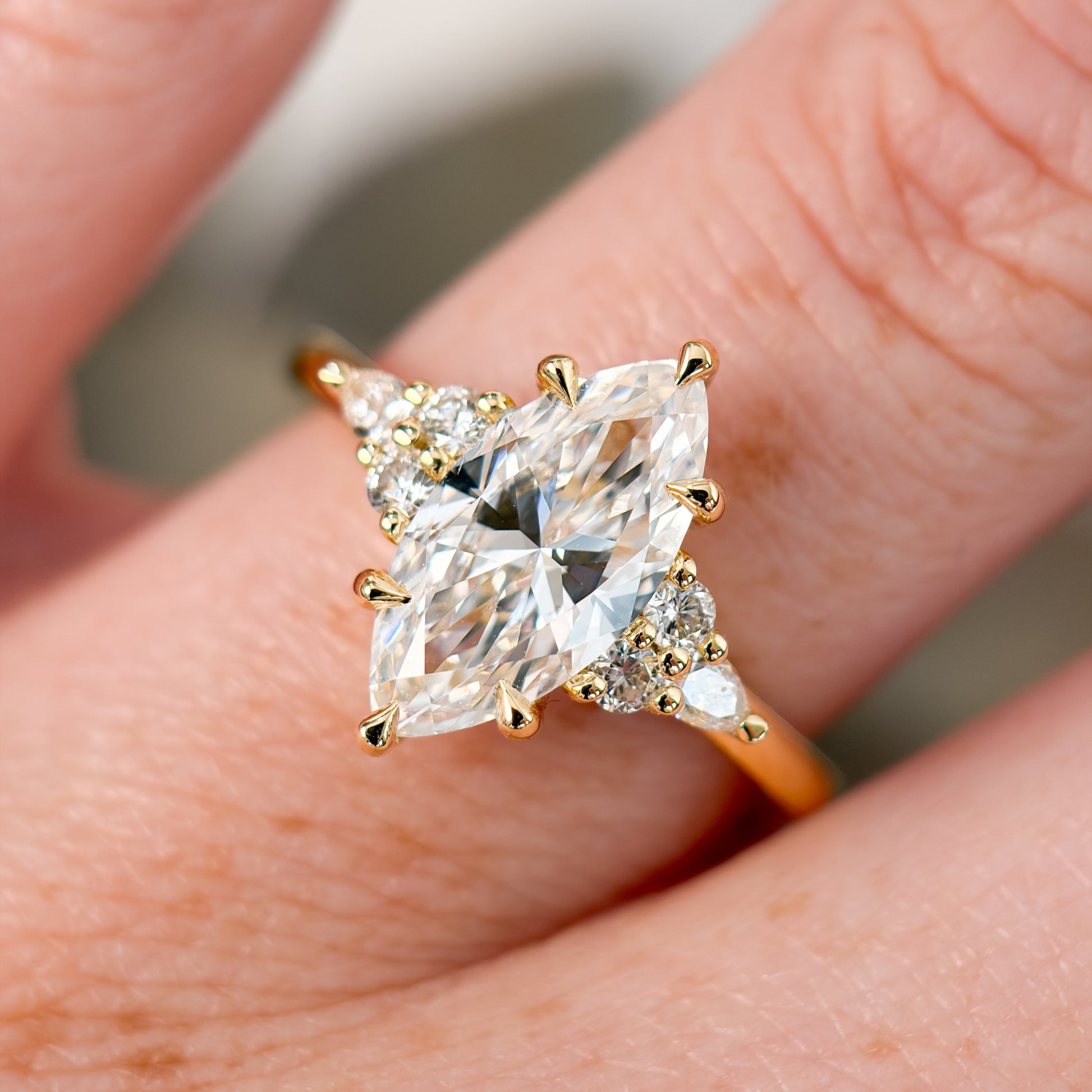 Marquise cut diamond engagement ring on hand