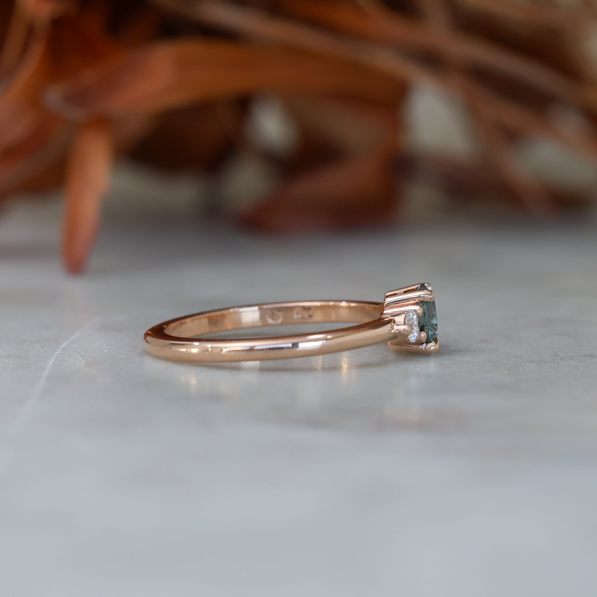 0.58ct Montana Sapphire trilogy engagement ring side view