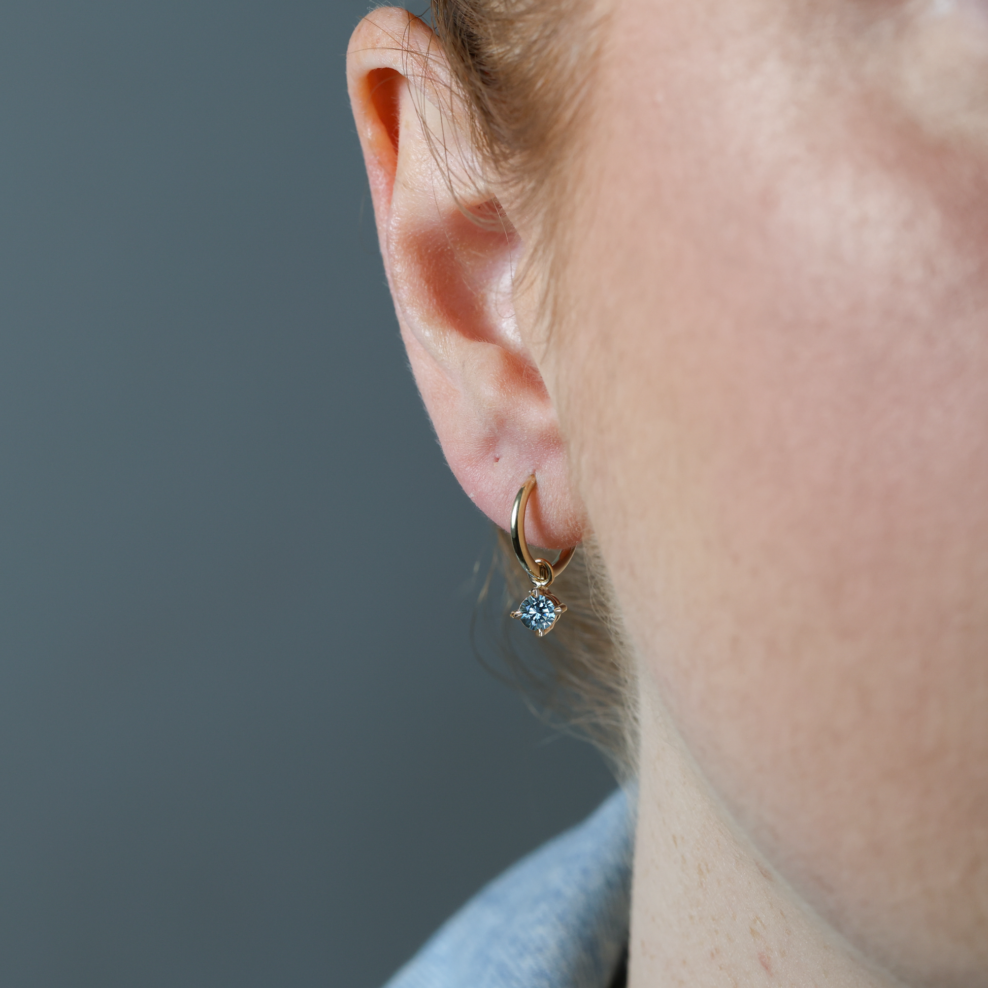 Montana Sapphire hoop earrings in ear