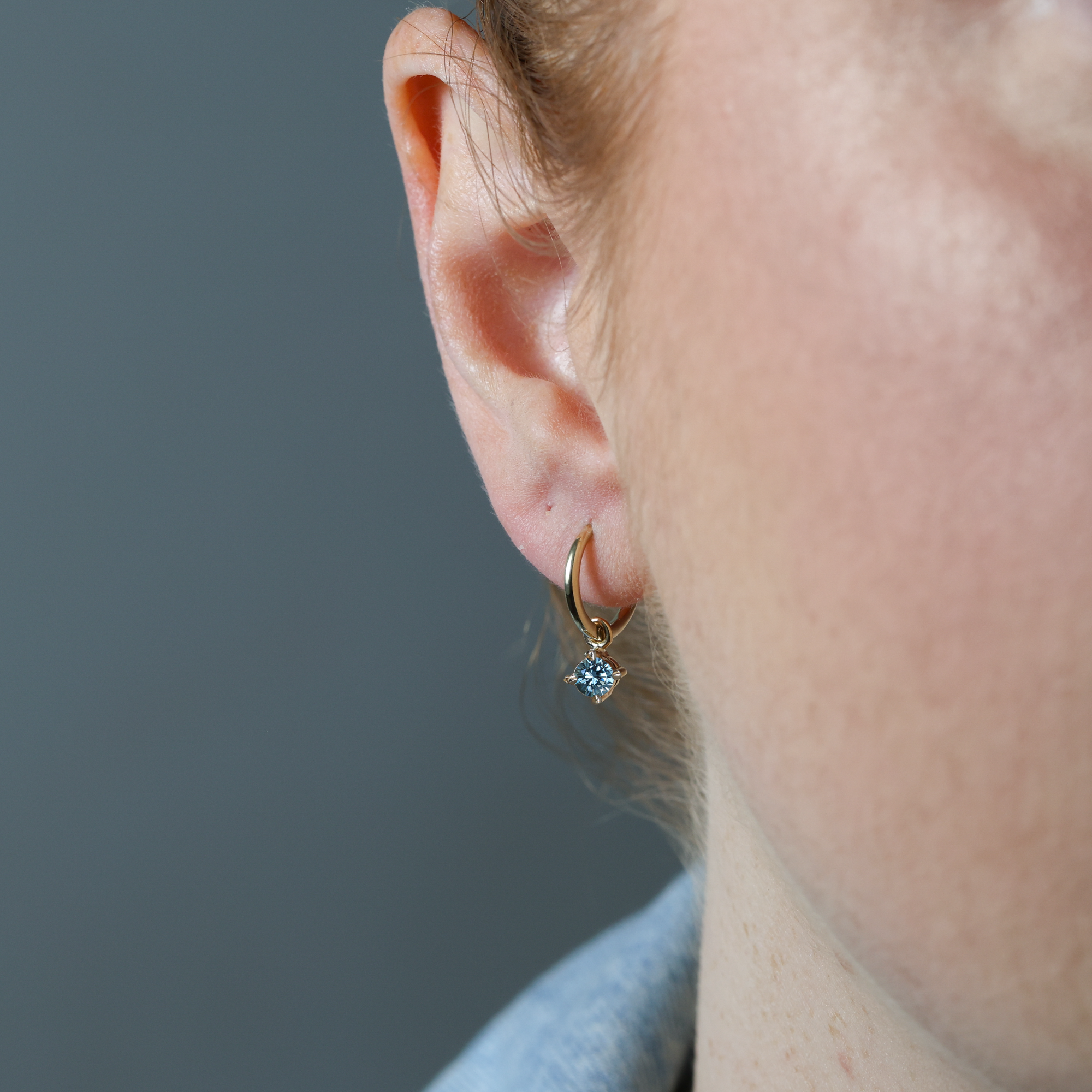 Montana Sapphire hoop earrings in ear