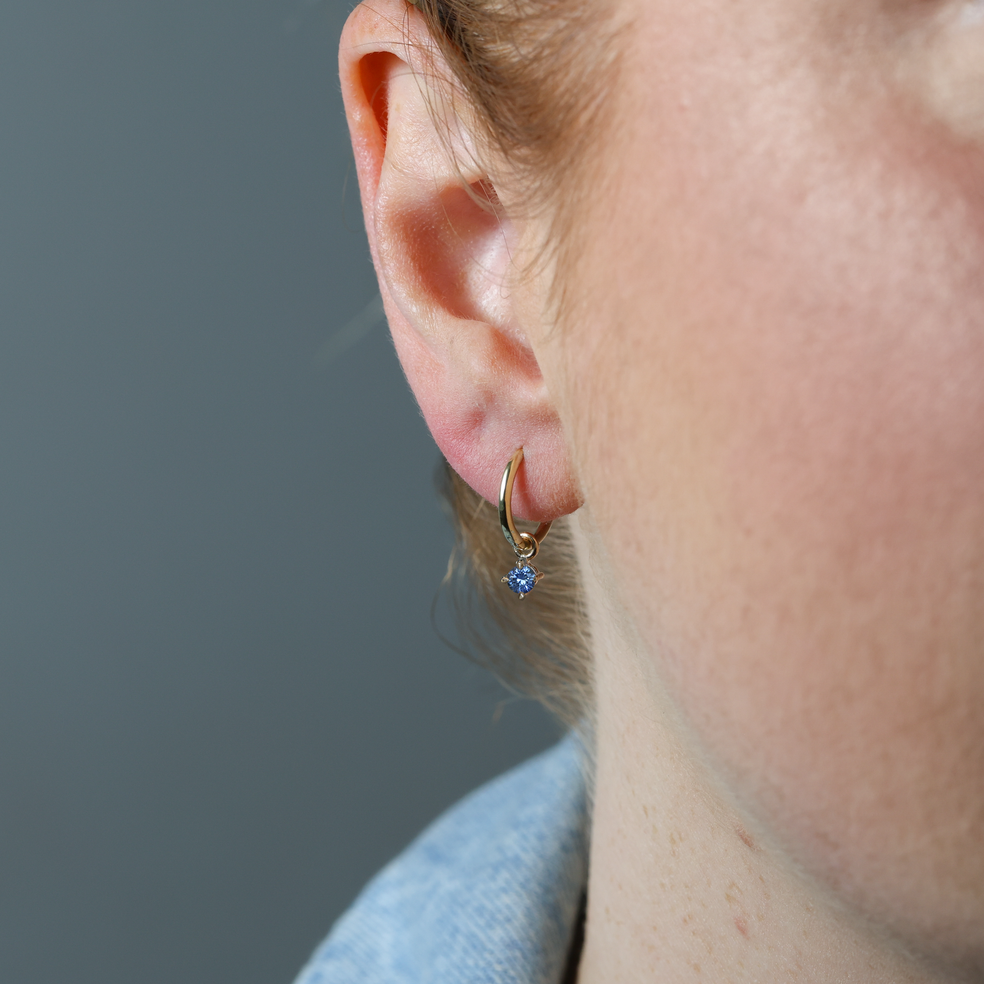 Montana sapphire hoop earring in ear
