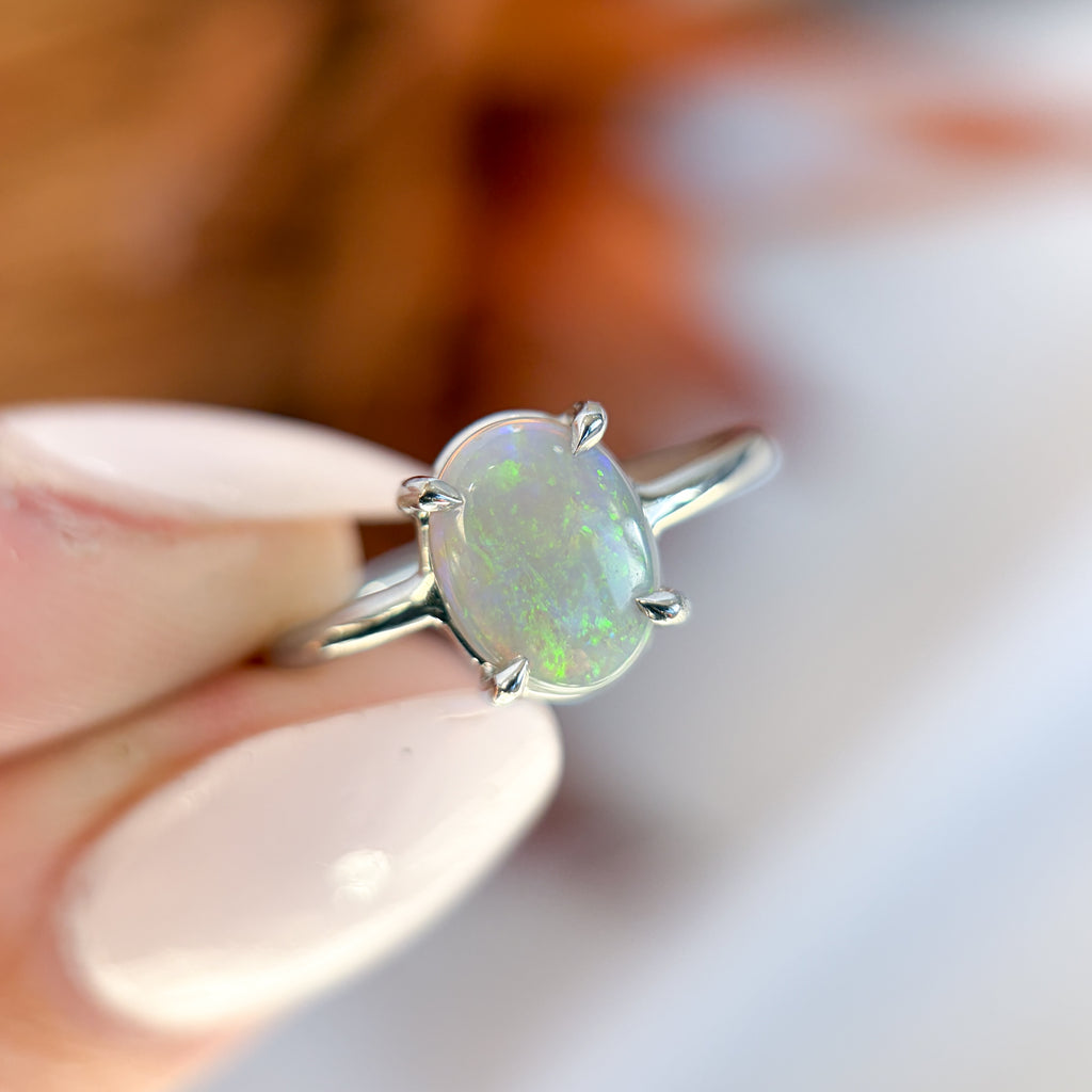 natural australian opal ring set in a white gold 4 claw setting