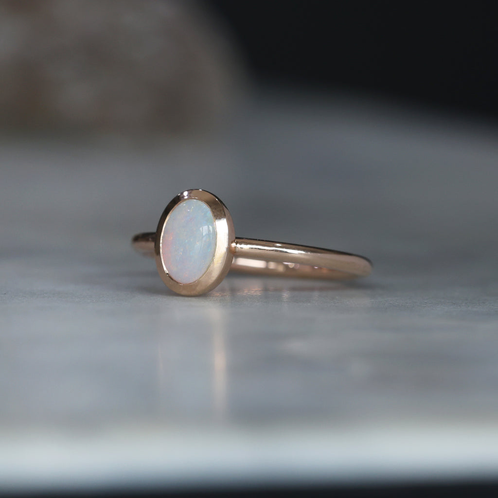 OVAL CUT OPAL / BEZEL SET RING