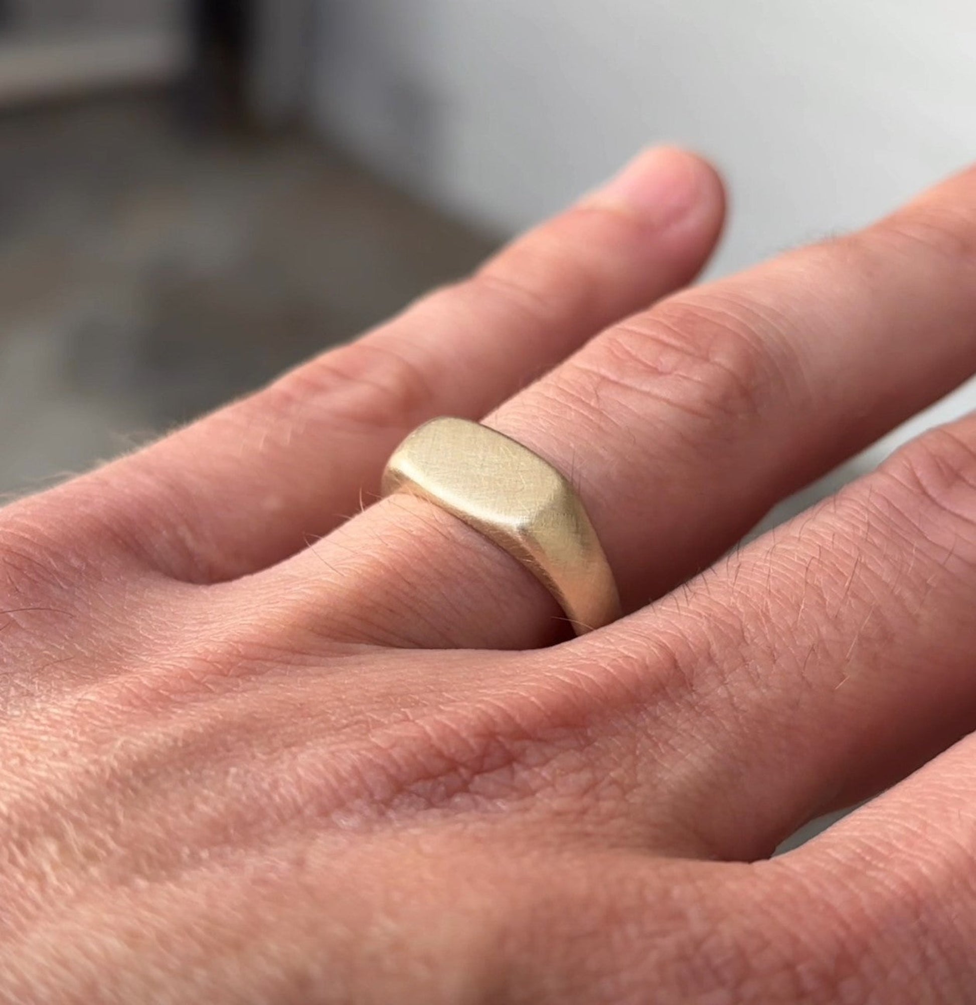 Rectangle Cushion Signet Ring on hand