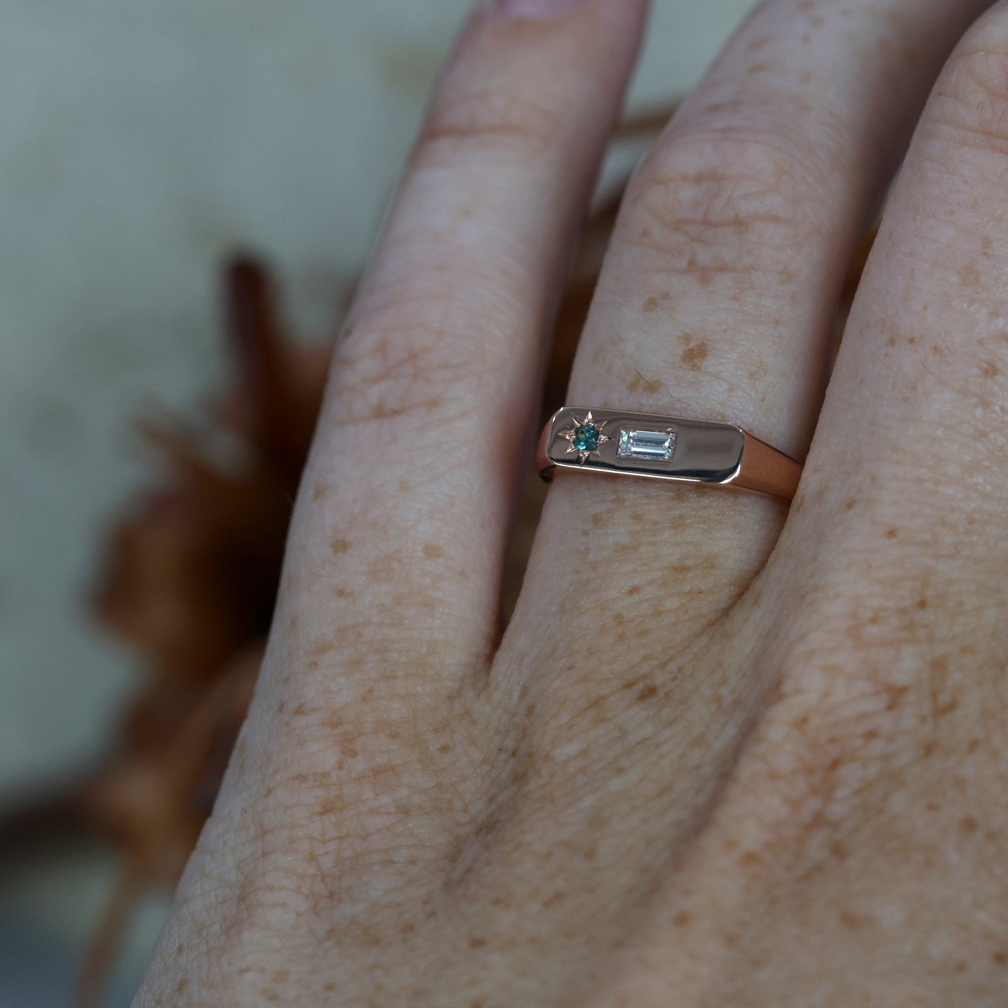 Rose Gold Diamond and Sapphire bar signet ring on hand