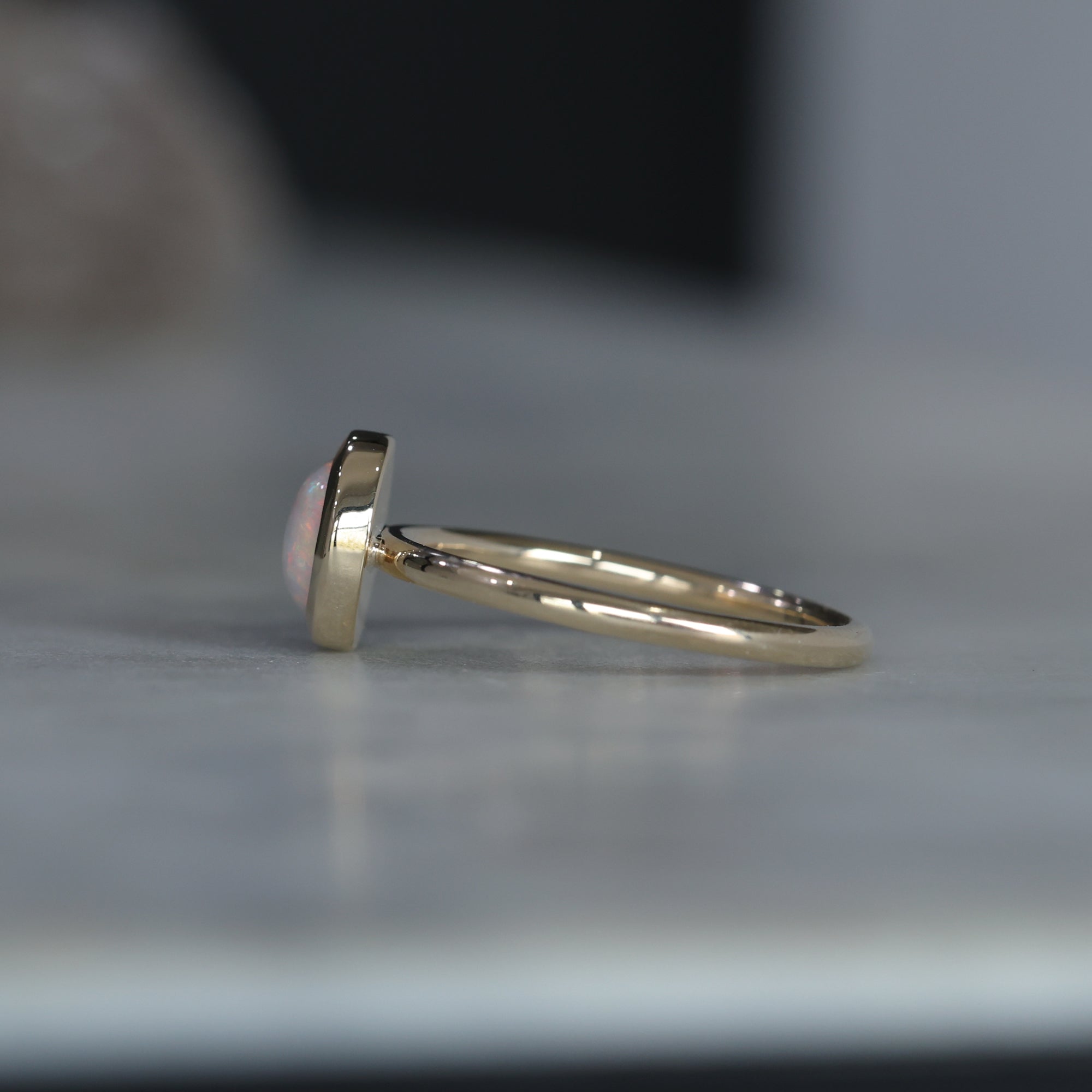 ROUND CUT OPAL / BEZEL SET RING