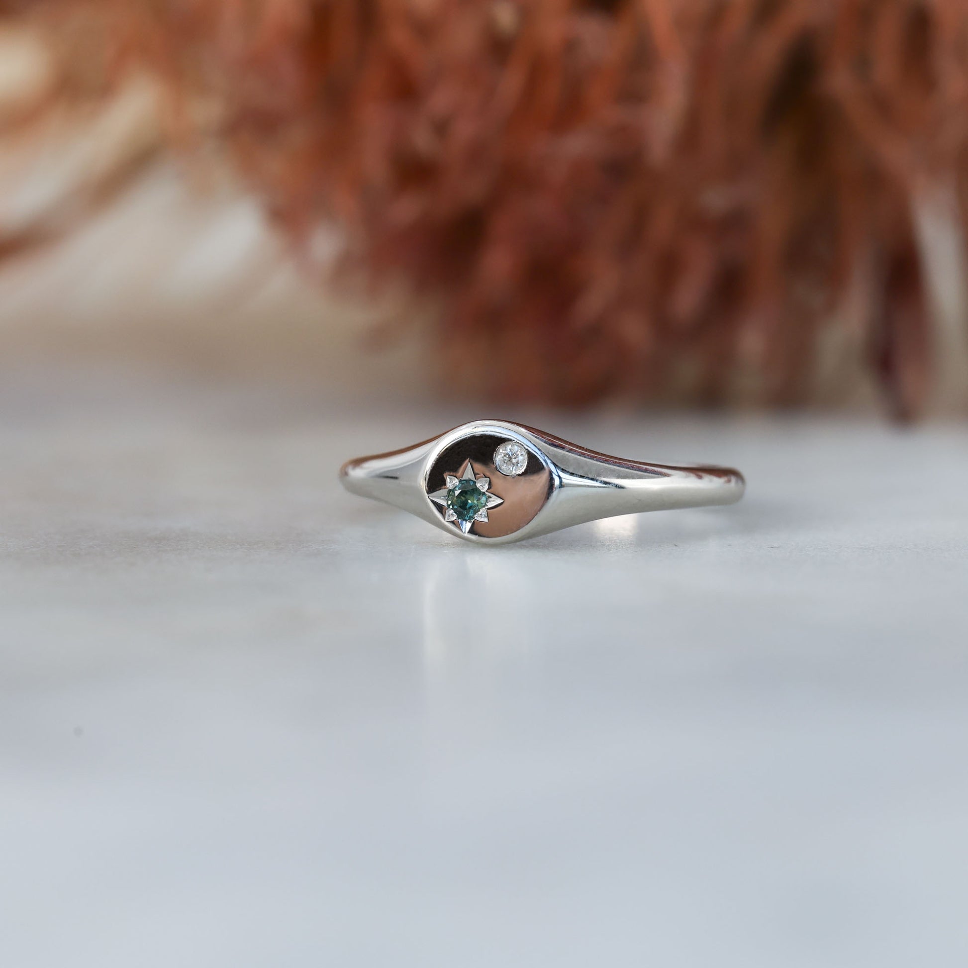 round australian sapphire and diamond signet ring white gold