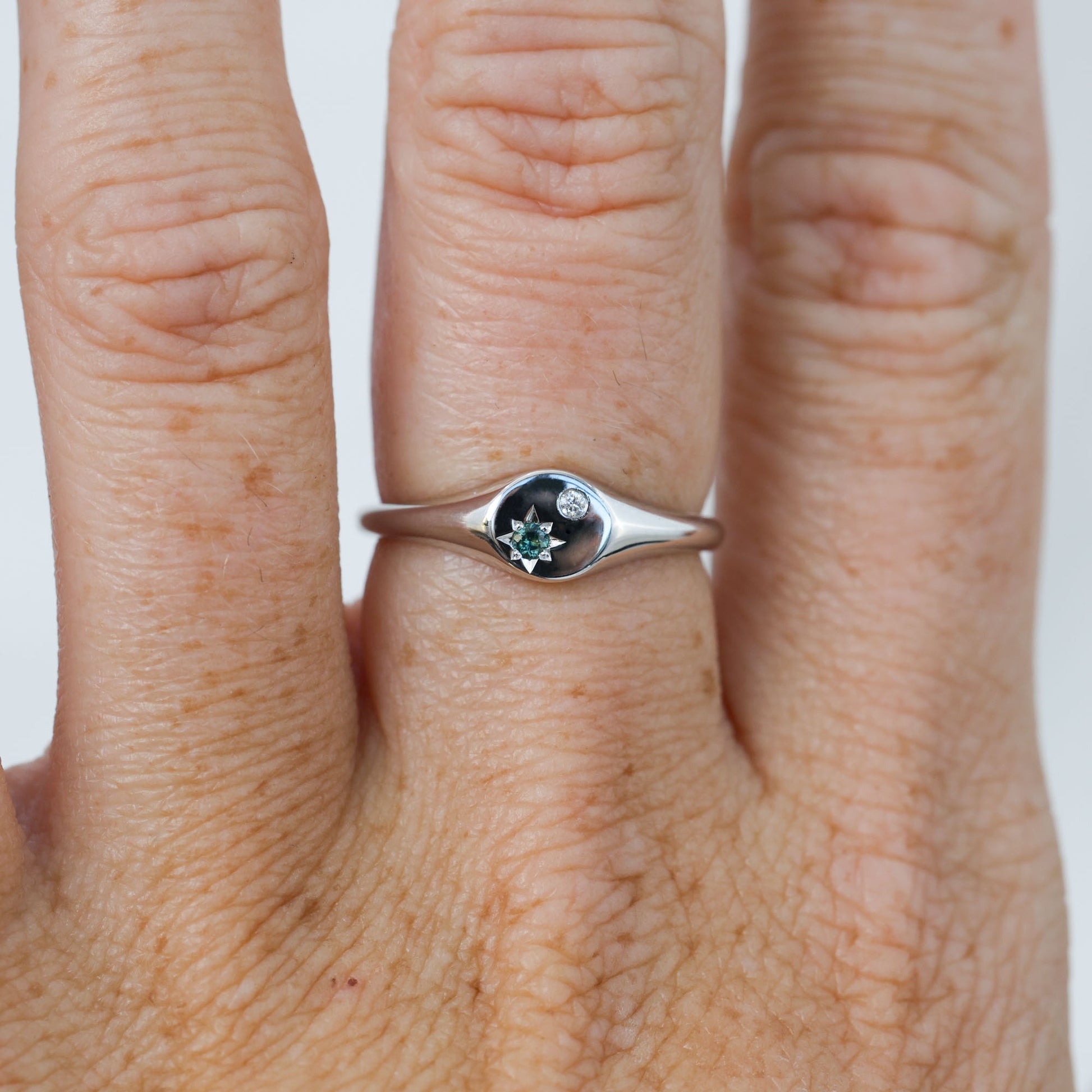 round australian sapphire and diamond signet ring white gold