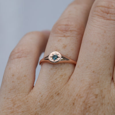 round star set australian sapphire signet ring in rose gold on hand