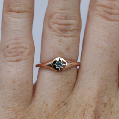 round star set australian sapphire signet ring in rose gold on hand
