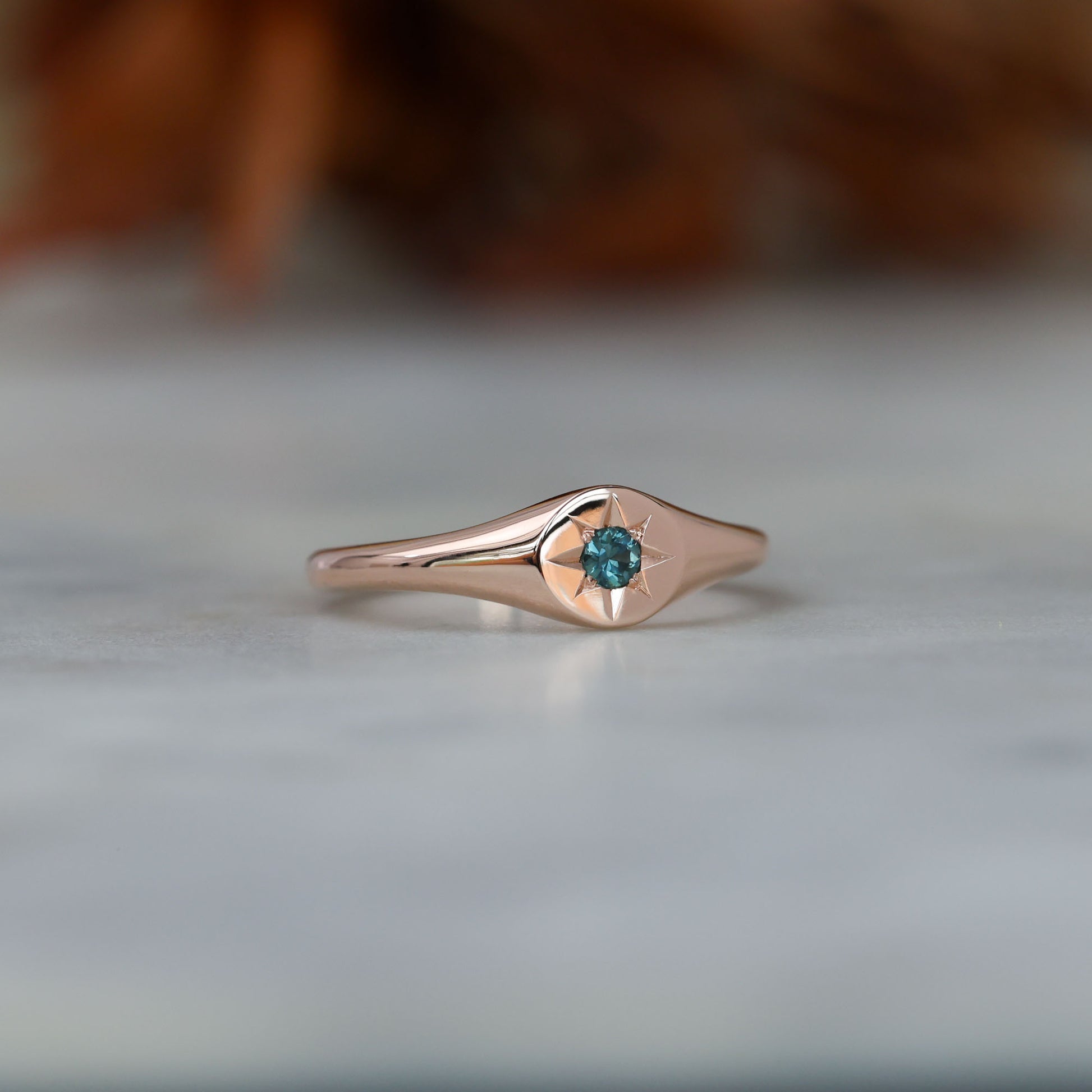 round star set australian sapphire signet ring in rose gold side
