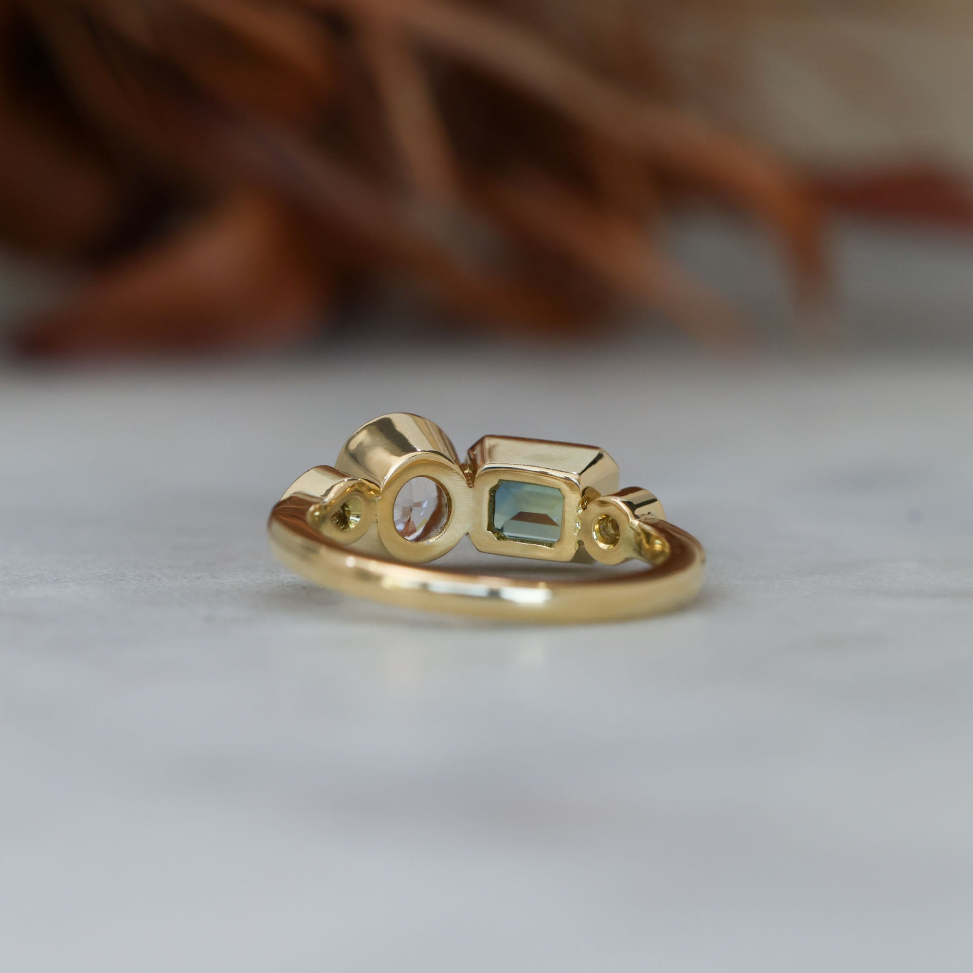 Sapphire and diamond asymmetric cluster ring, crafted in 18ct yellow gold