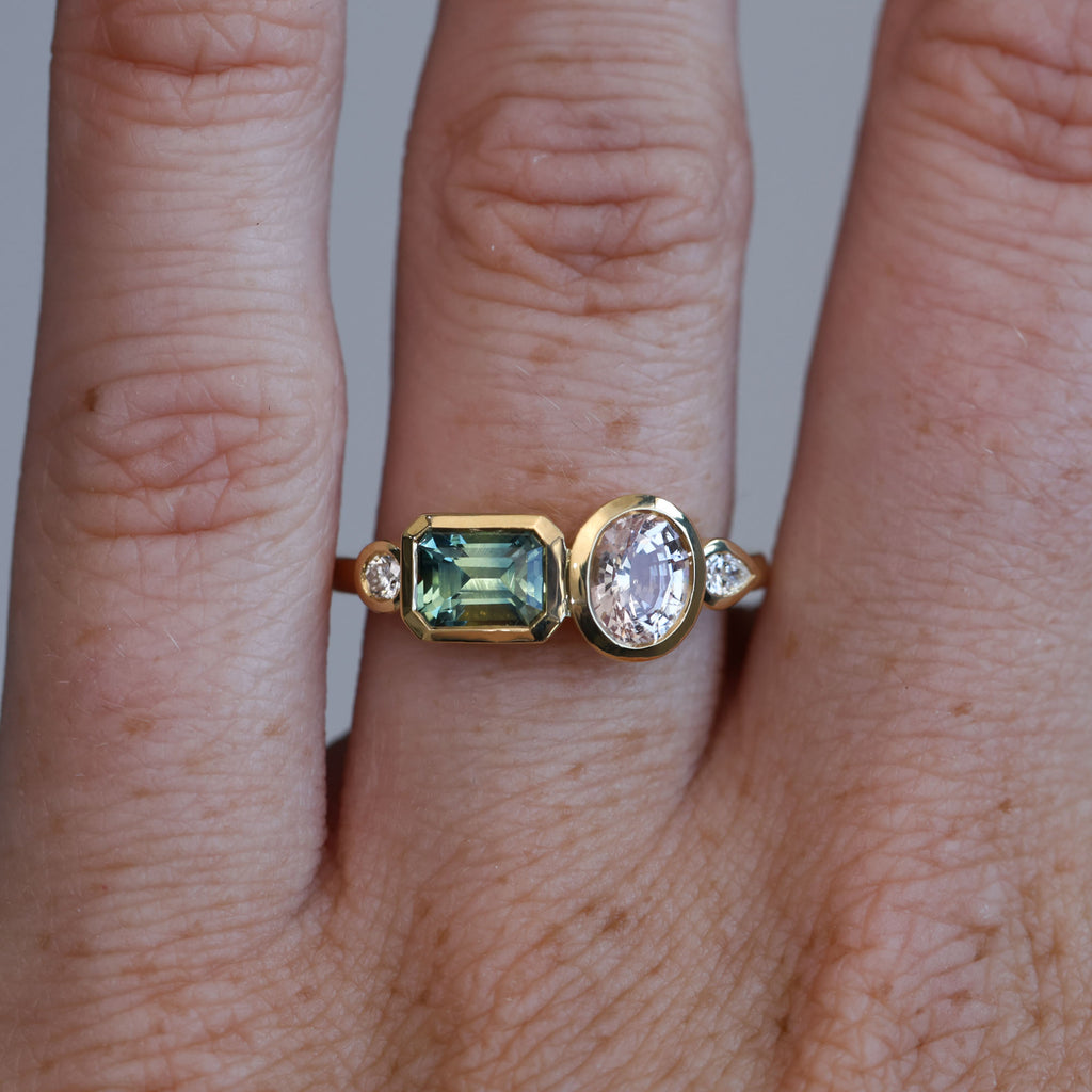 Sapphire and diamond asymmetric cluster ring, crafted in 18ct yellow gold on hand