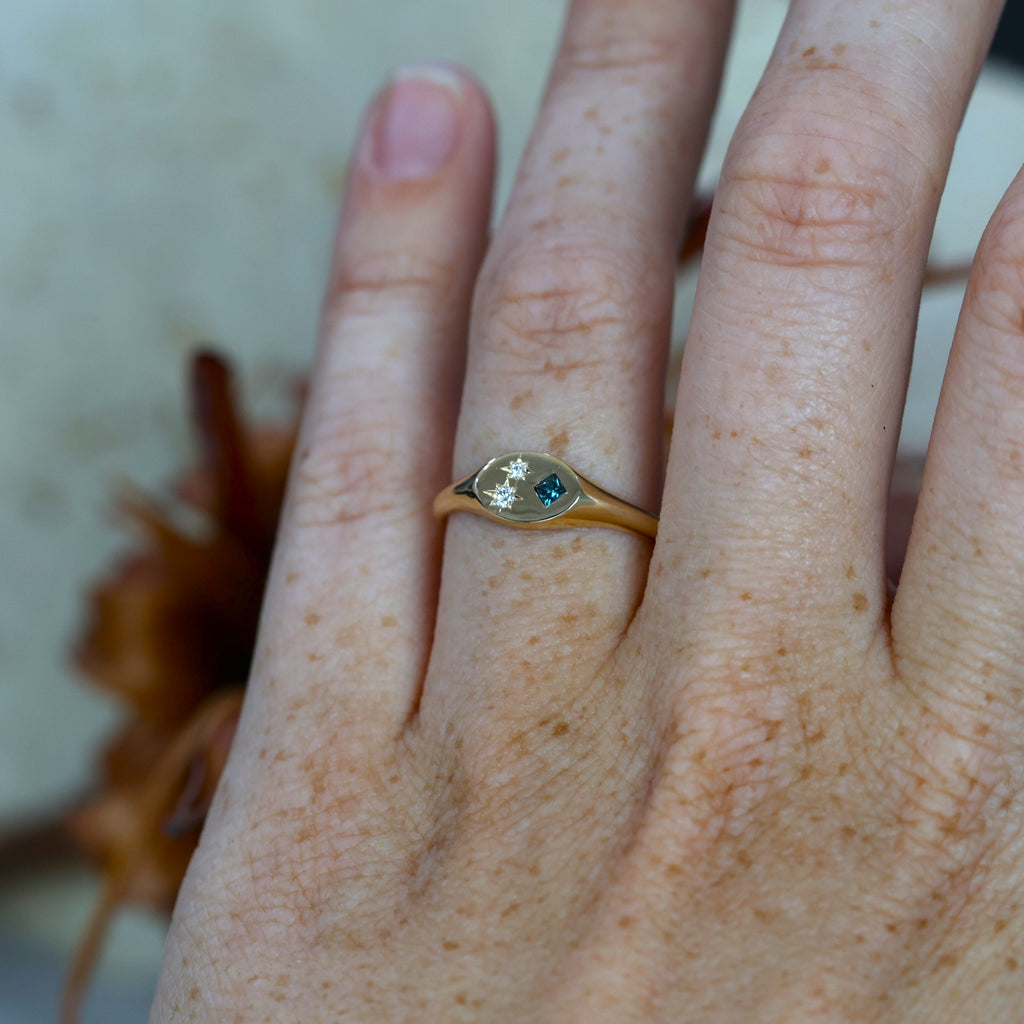Set Sapphire and Diamond Signet Ring on hand