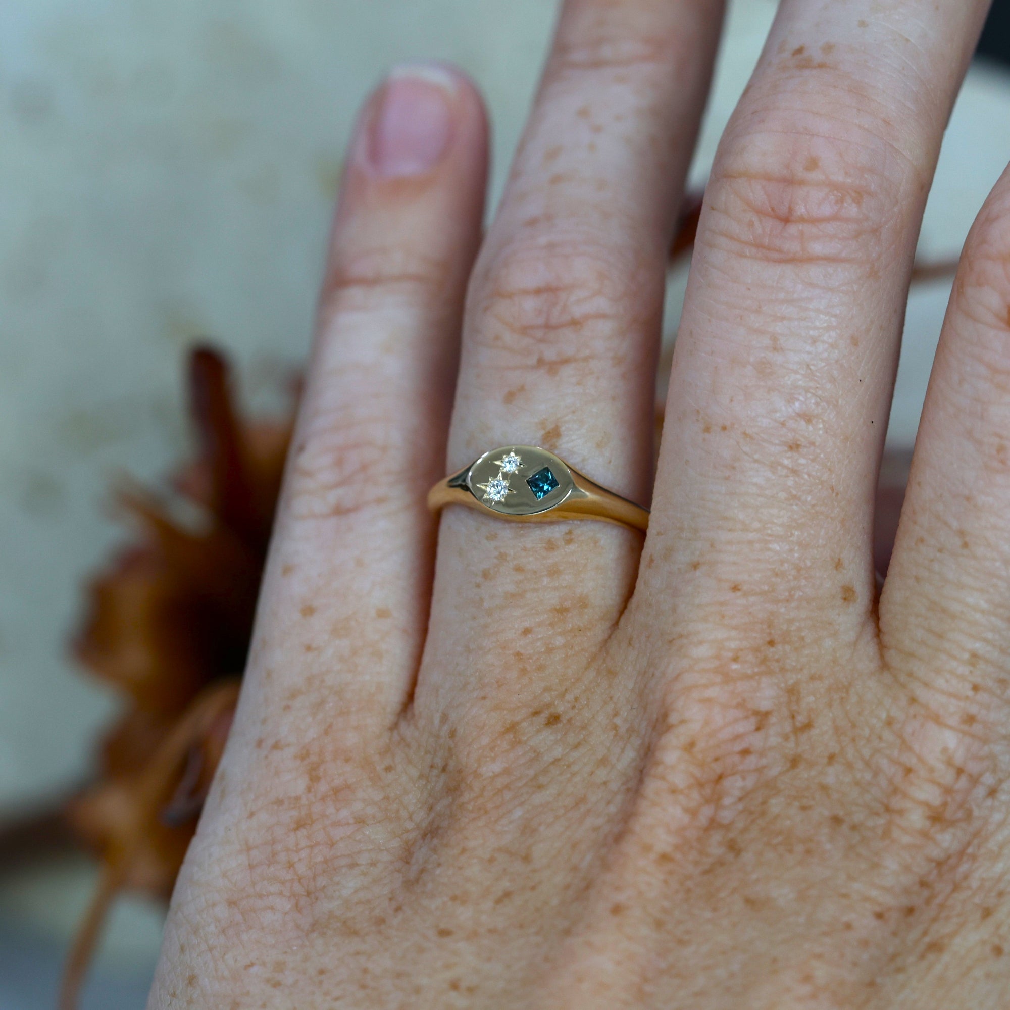 Set Sapphire and Diamond Signet Ring on hand