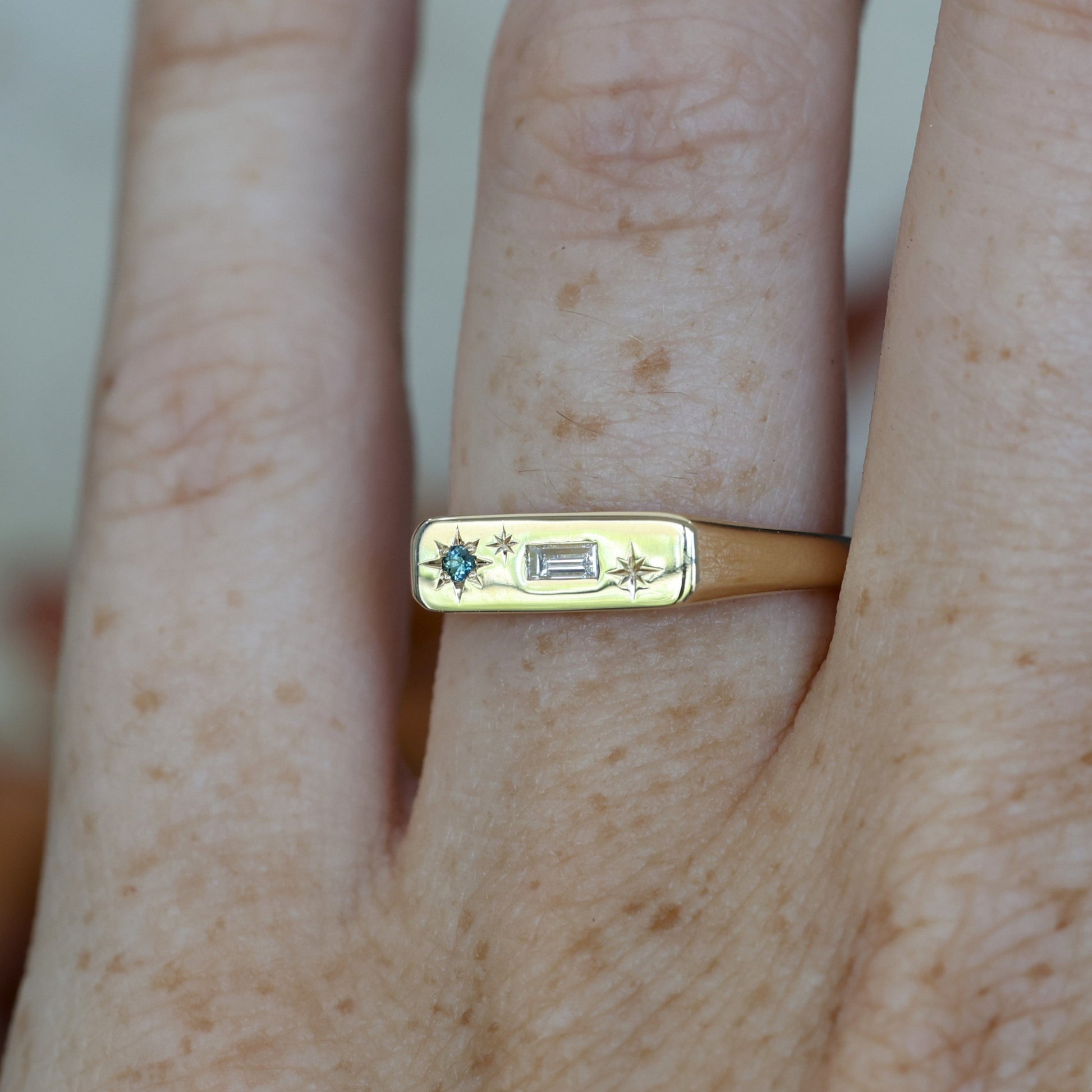 Star Design Diamond & Sapphire bar signet ring on hand