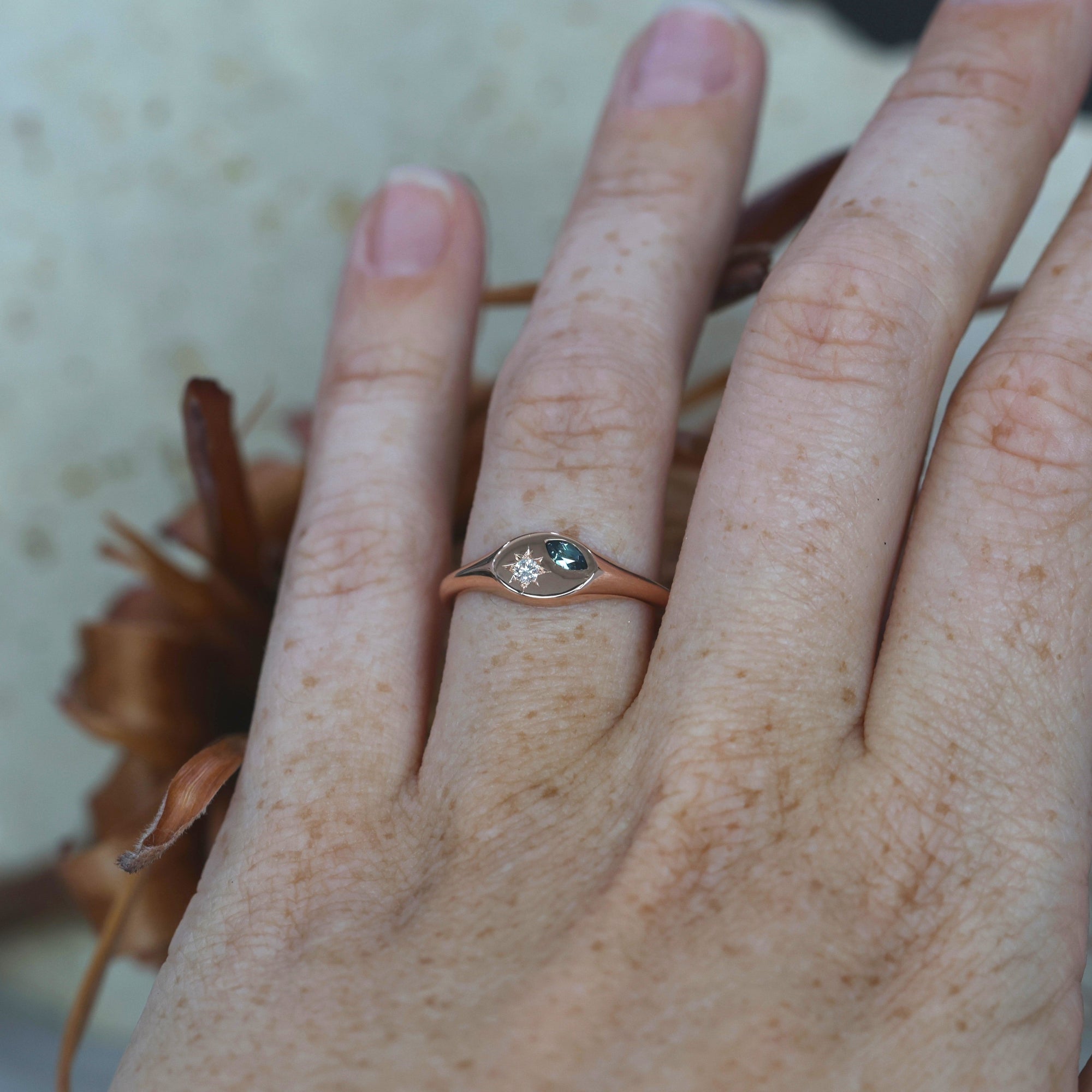 Star Set Sapphire and Diamond Signet Ring on hand