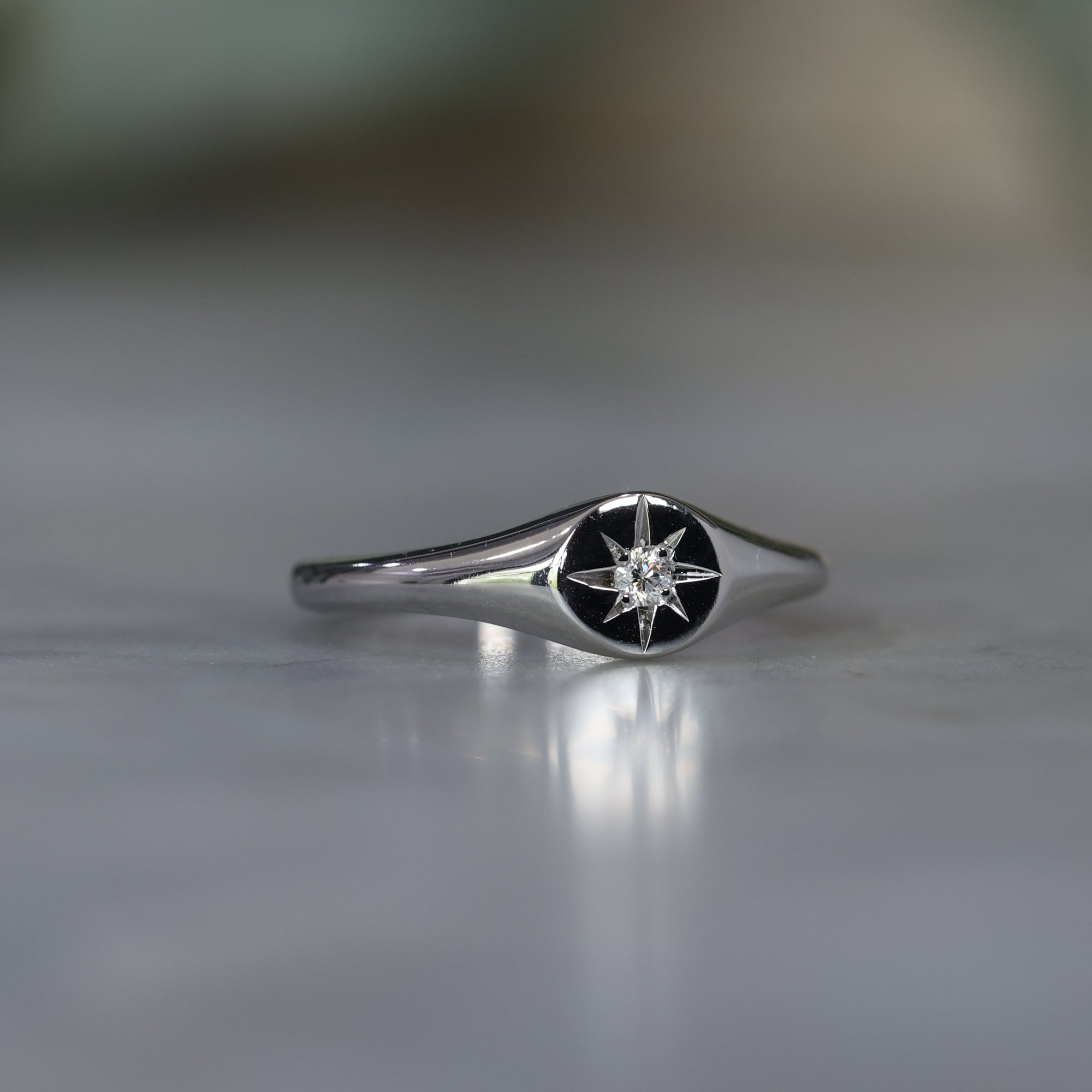 White diamond signet ring side view