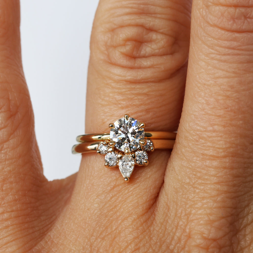 ally diamond wedding band with engagement ring on hand