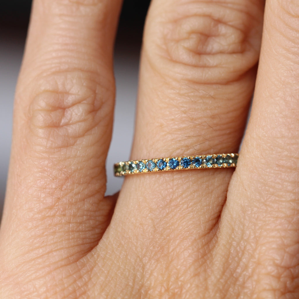 australian sapphire gradient ring on hand