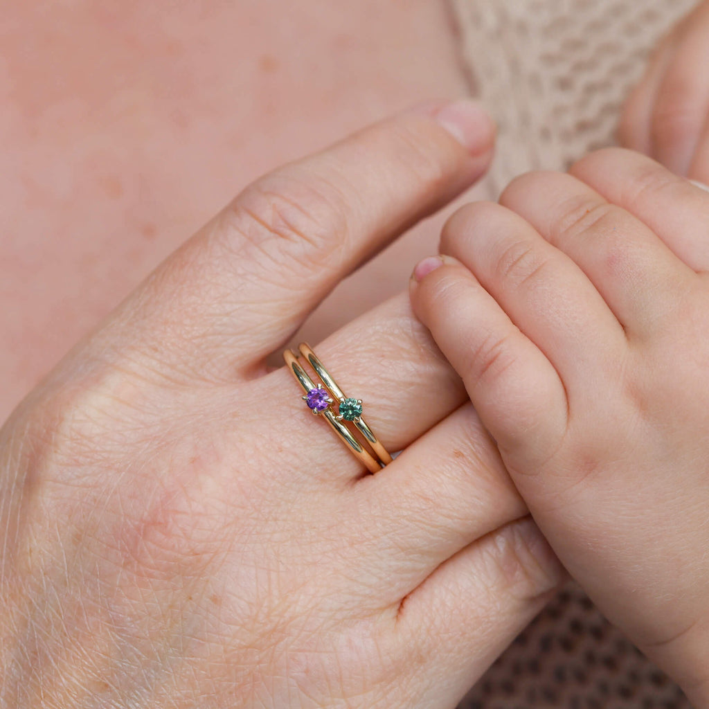 birthstone stack rings on hand