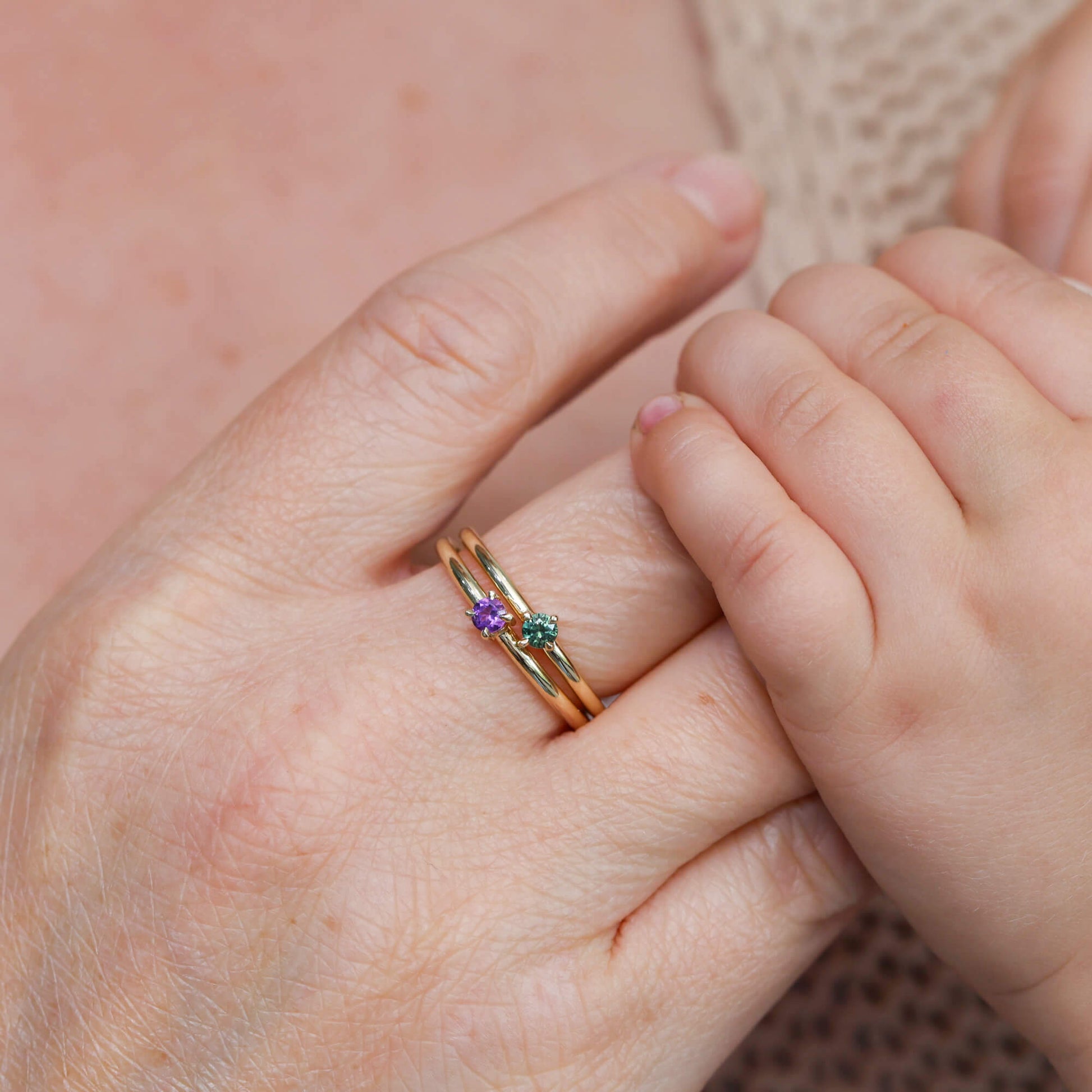 birthstone stack rings on hand
