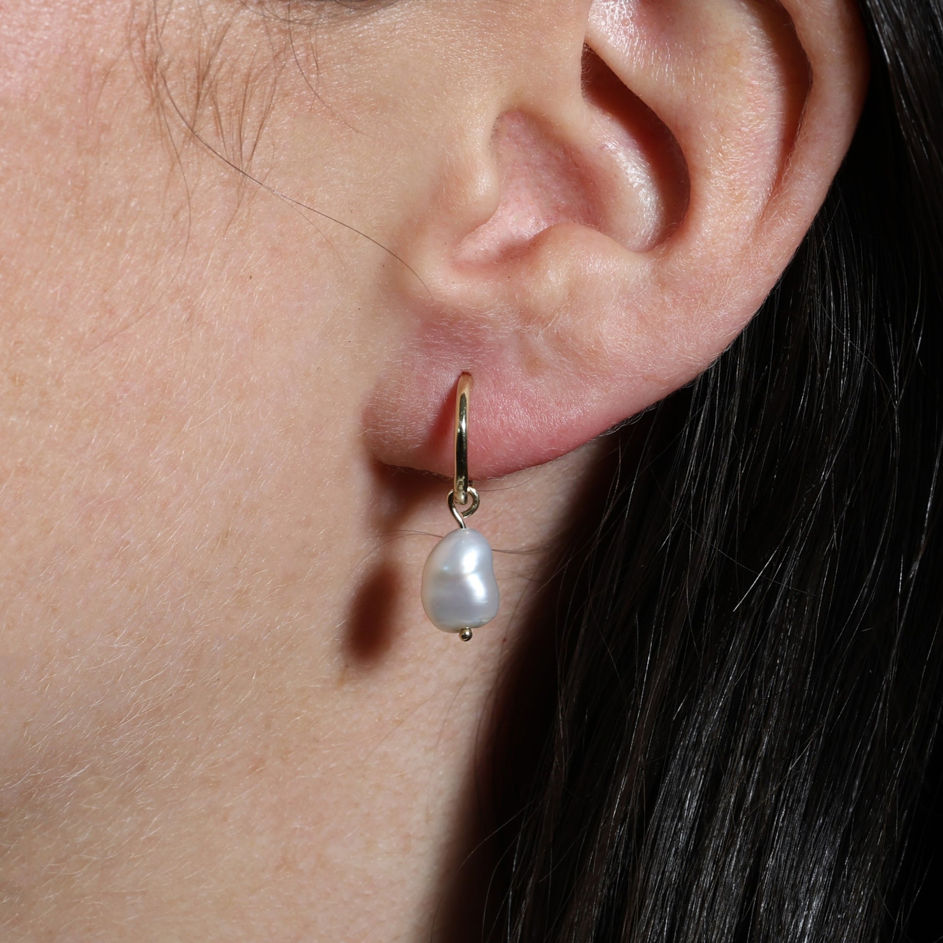 classic pearl hoop earring in ear