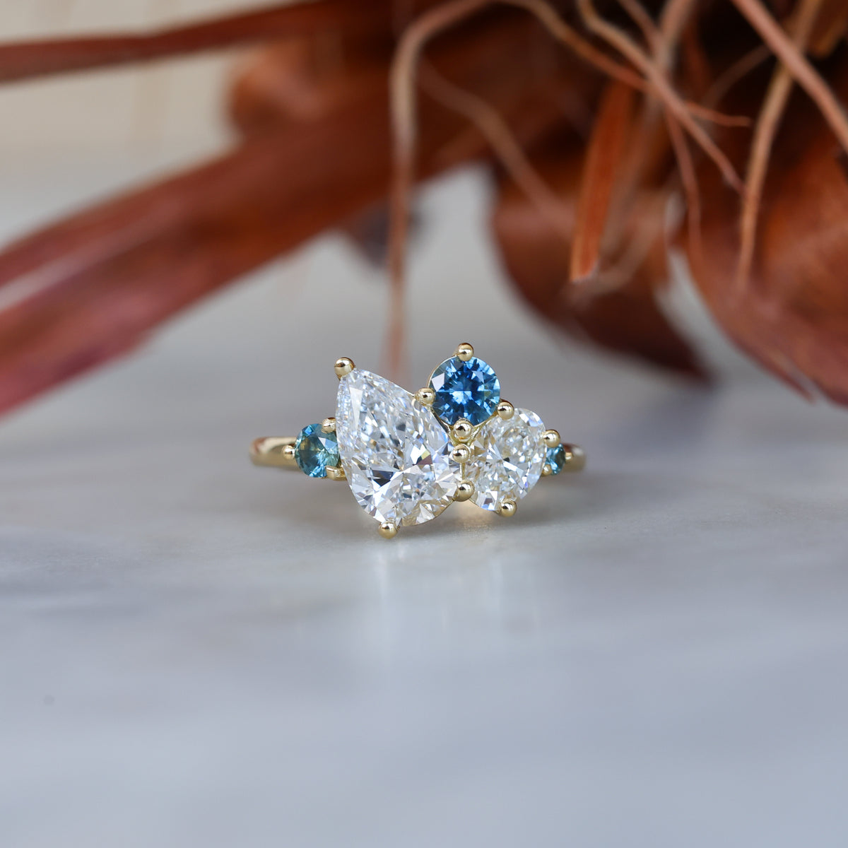 DELILAH | DIAMOND & MONTANA SAPPHIRE CLUSTER ENGAGEMENT RING