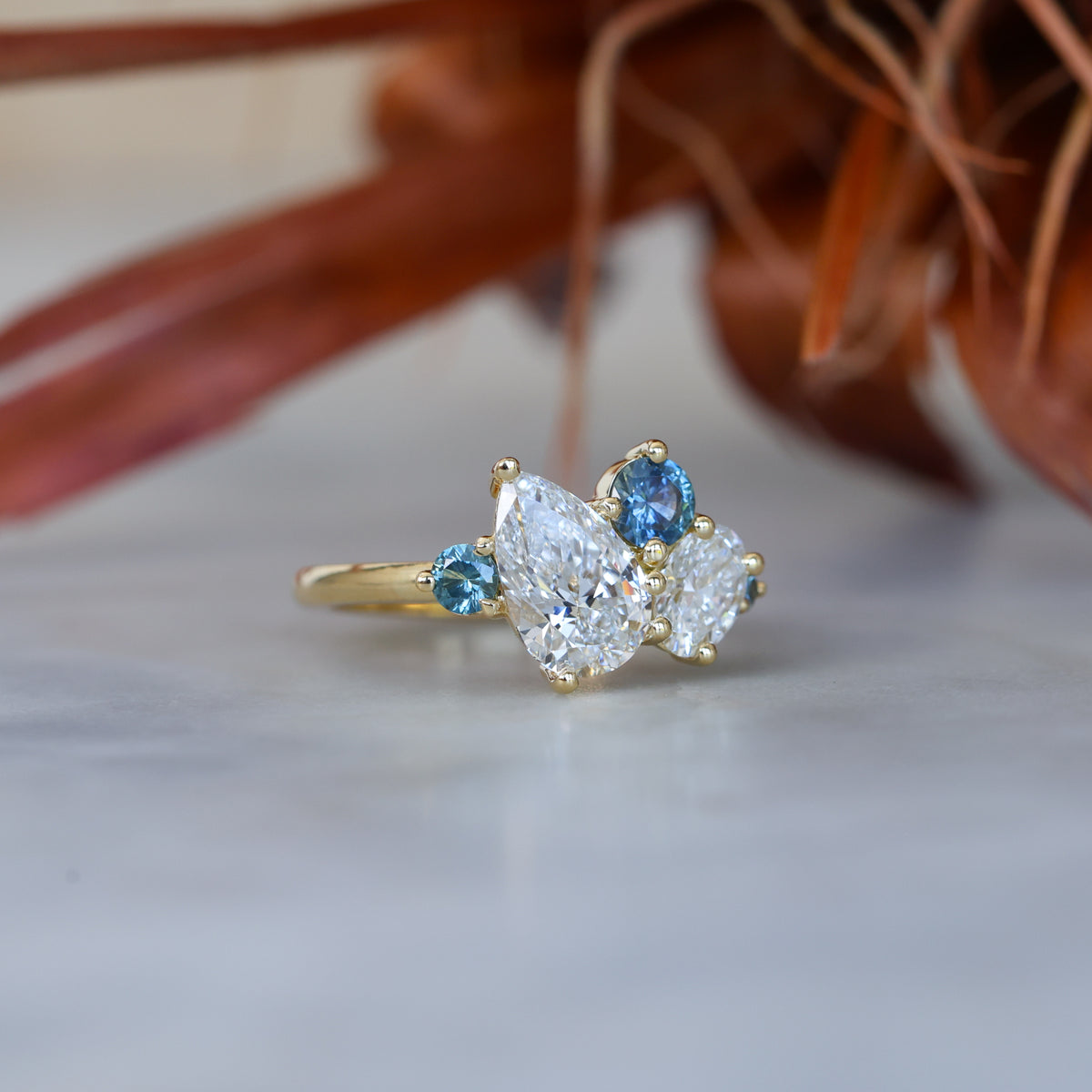 DELILAH | DIAMOND & MONTANA SAPPHIRE CLUSTER ENGAGEMENT RING