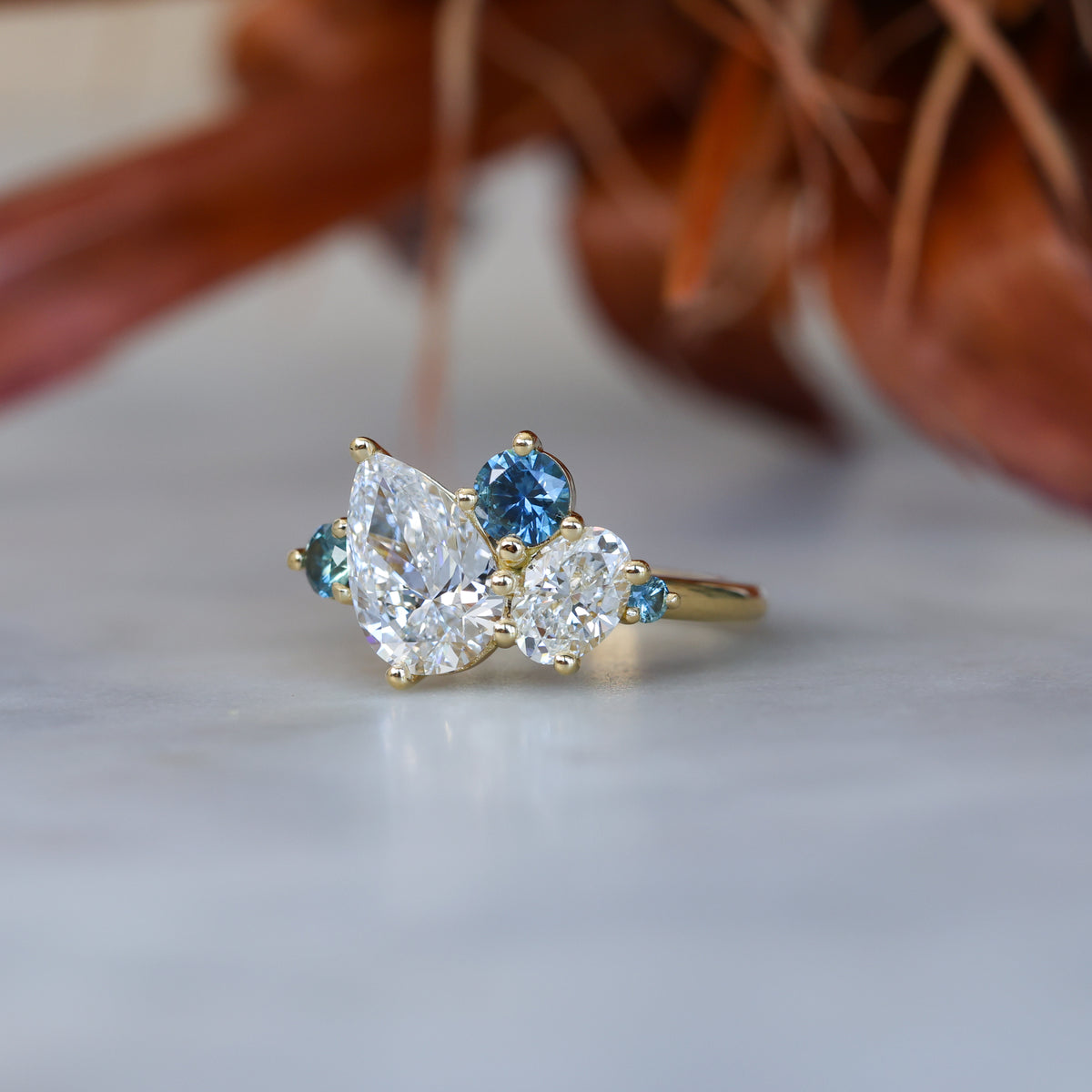 DELILAH | DIAMOND & MONTANA SAPPHIRE CLUSTER ENGAGEMENT RING