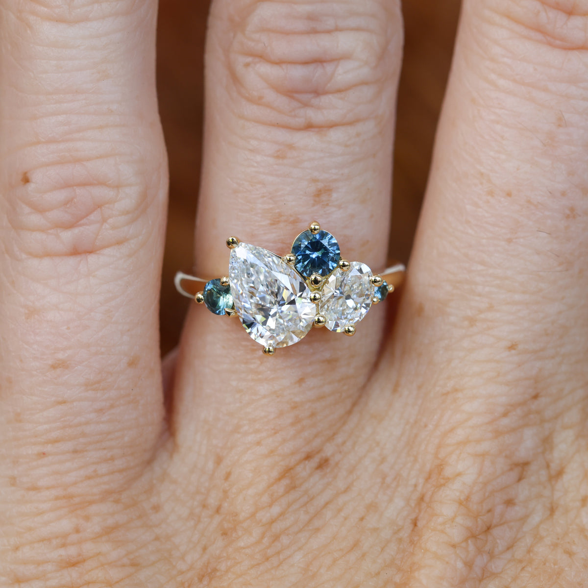 DELILAH | DIAMOND & MONTANA SAPPHIRE CLUSTER ENGAGEMENT RING