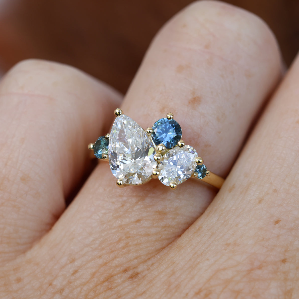 DELILAH | DIAMOND & MONTANA SAPPHIRE CLUSTER ENGAGEMENT RING
