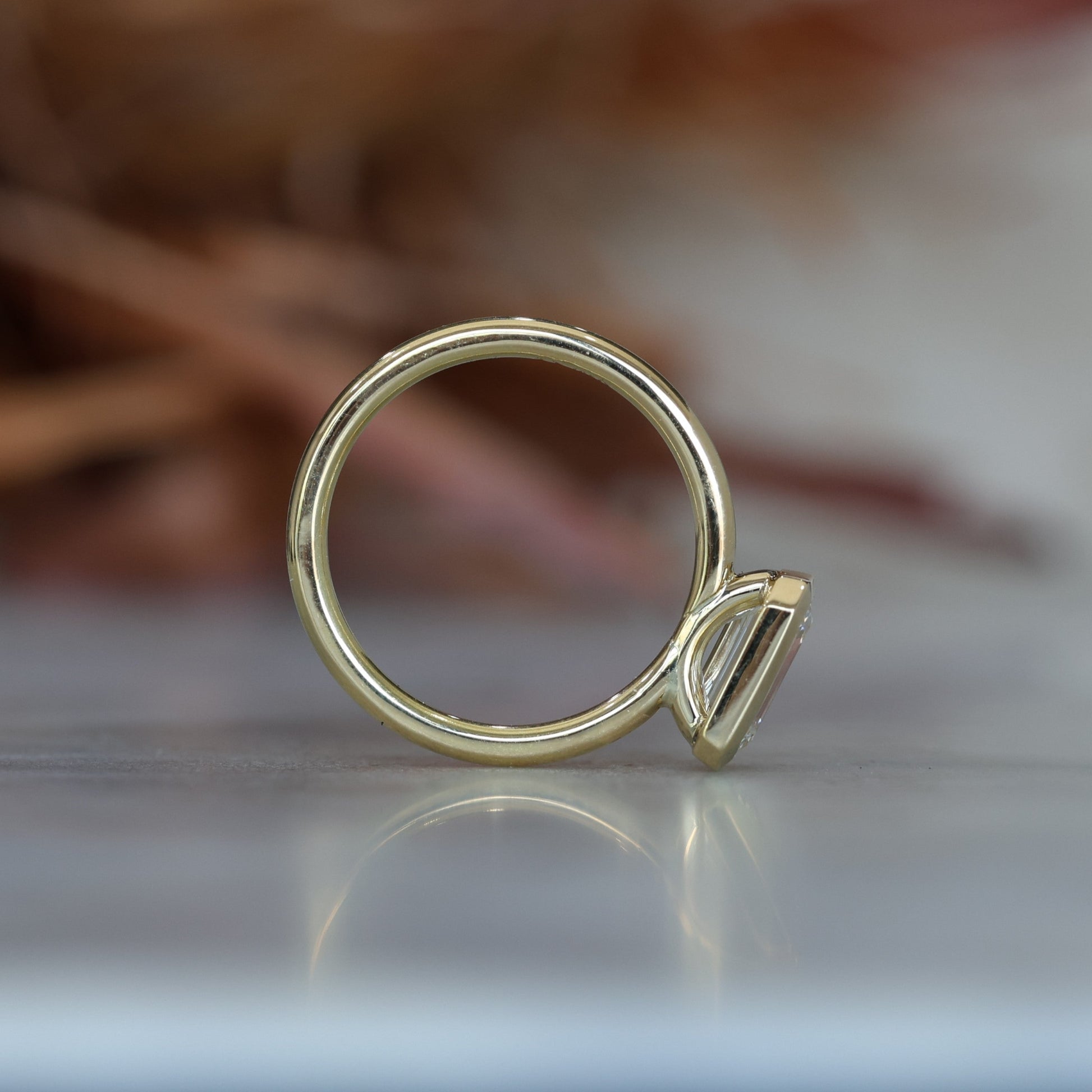 emerald cut 1.36ct bezel set diamond engagement ring