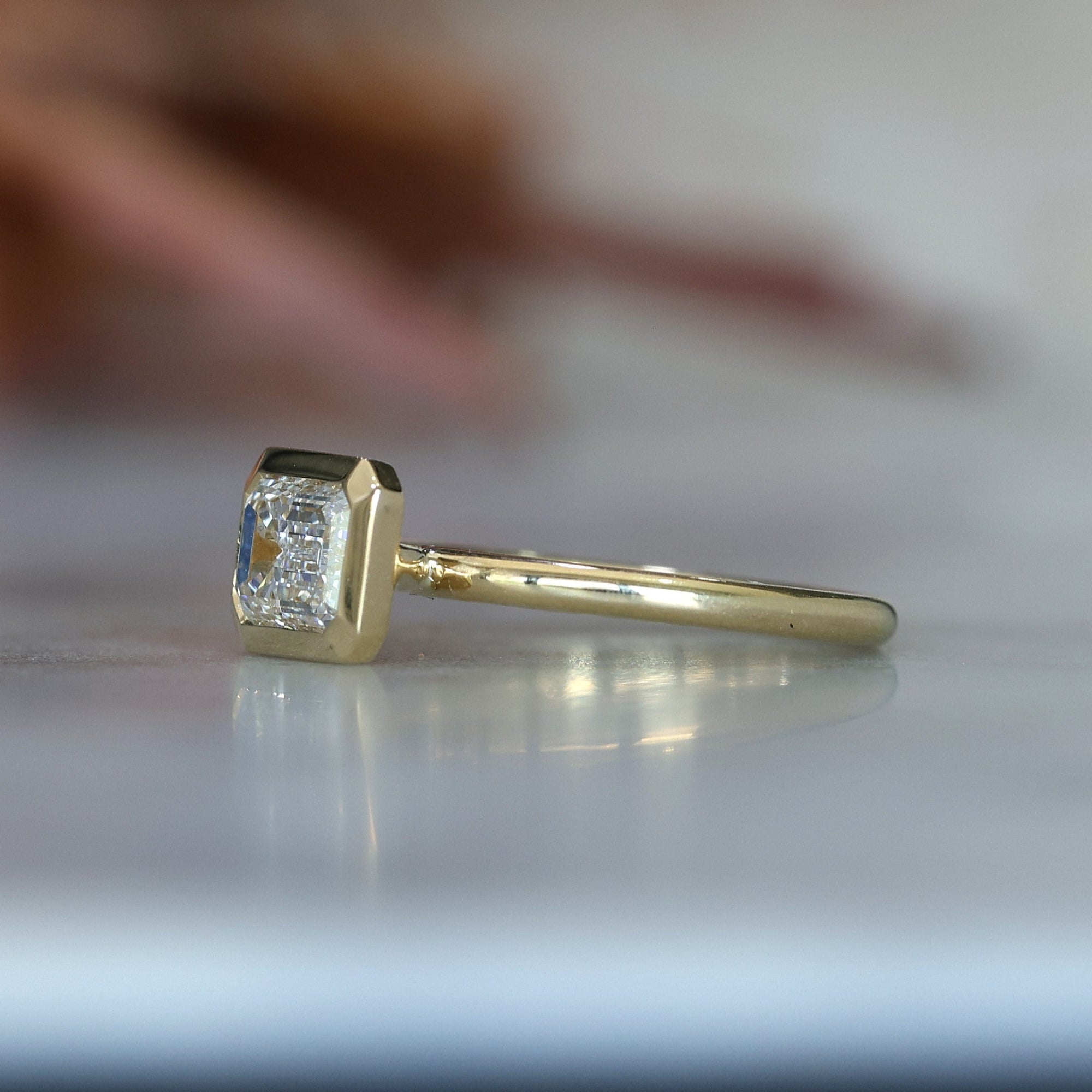 emerald cut 1.36ct bezel set diamond engagement ring