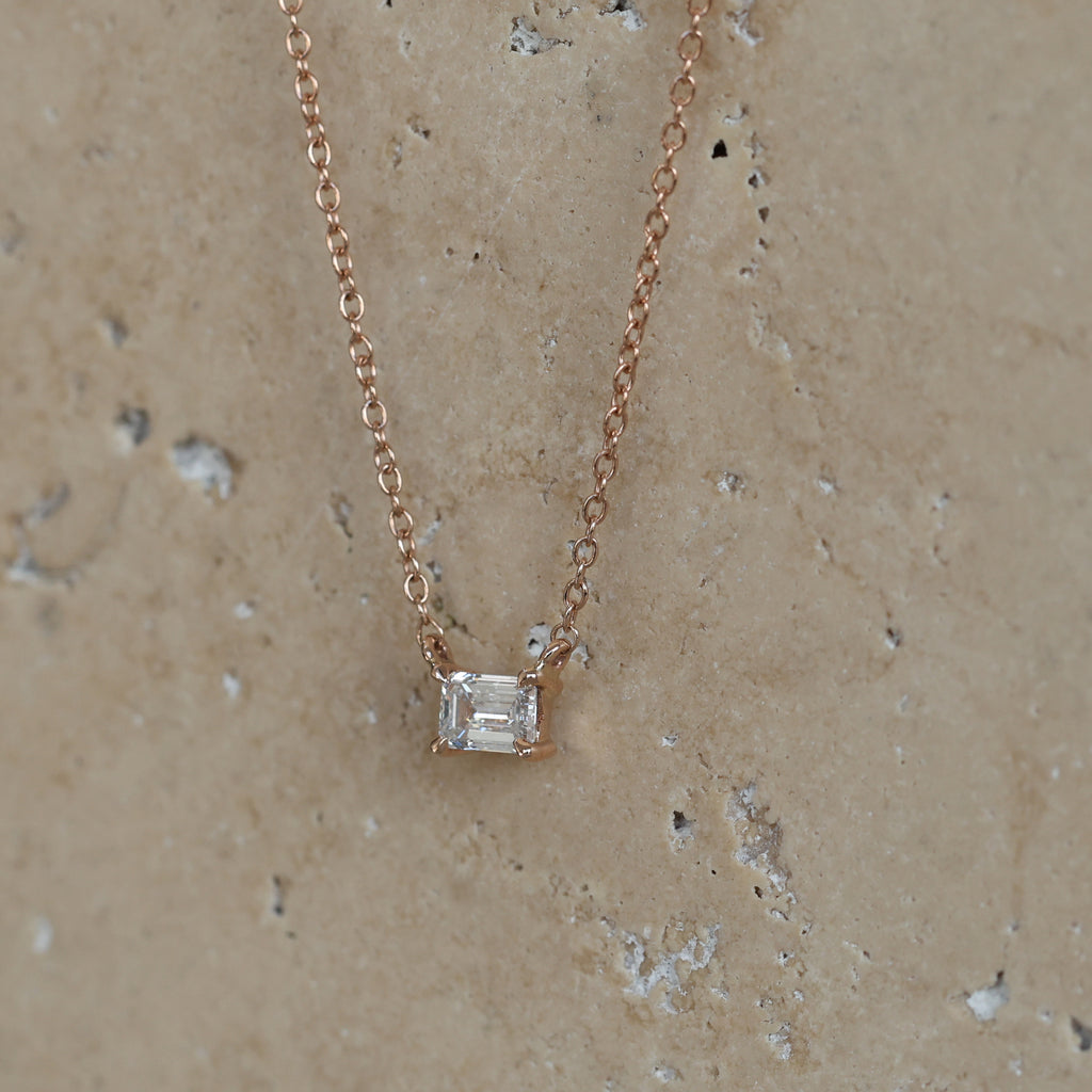 emerald cut white diamond necklace side