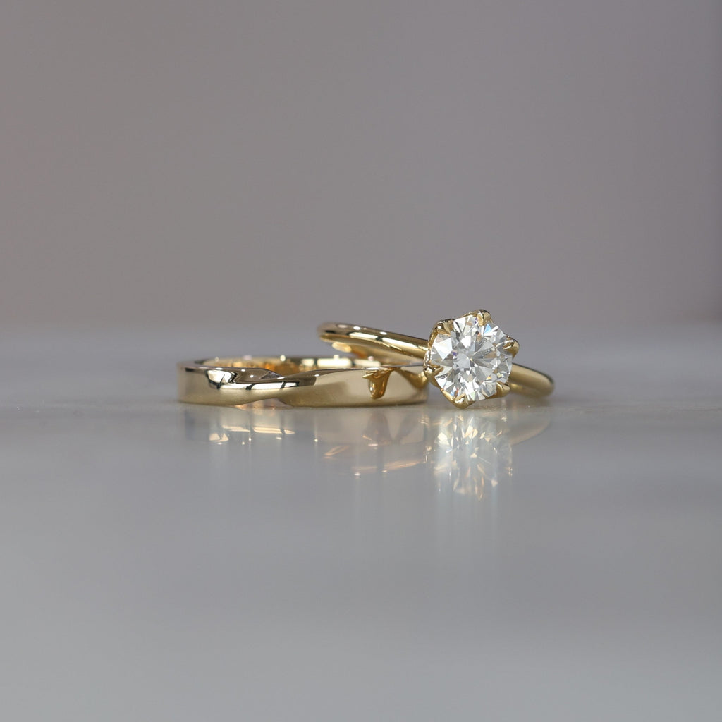 gold mobius twist wedding band with eng ring